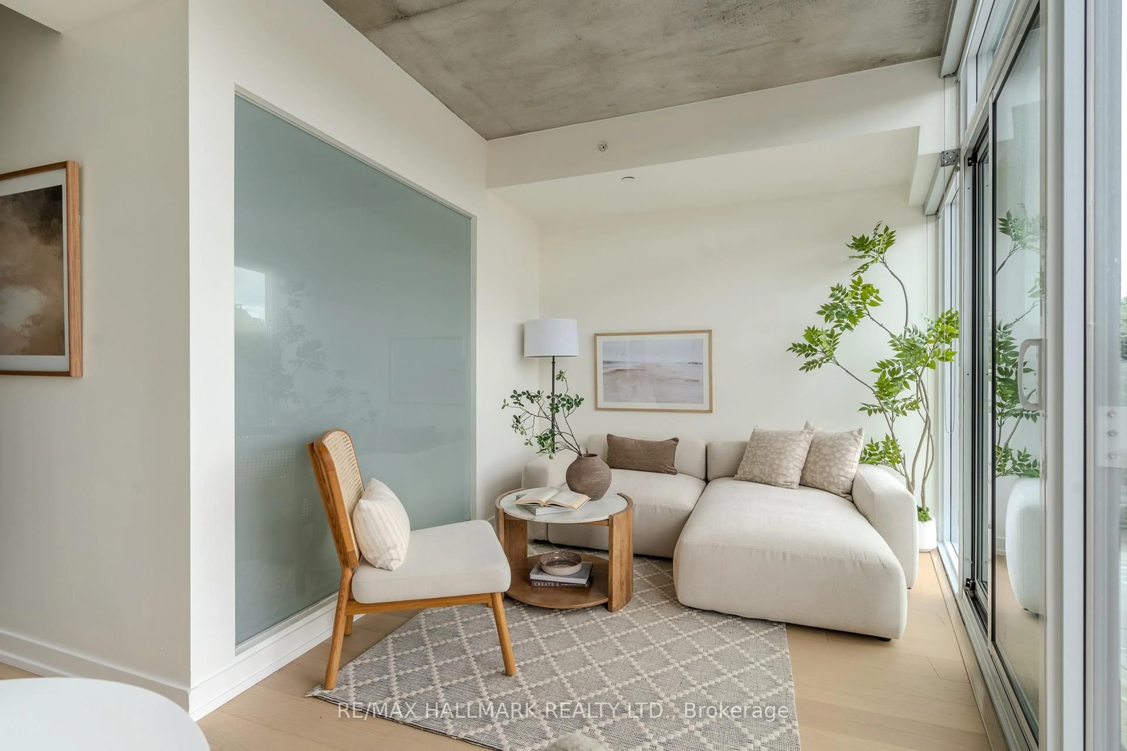 Living room with furniture, cement floor for 60 Haslett Ave #404, Toronto Ontario M4L 0A9