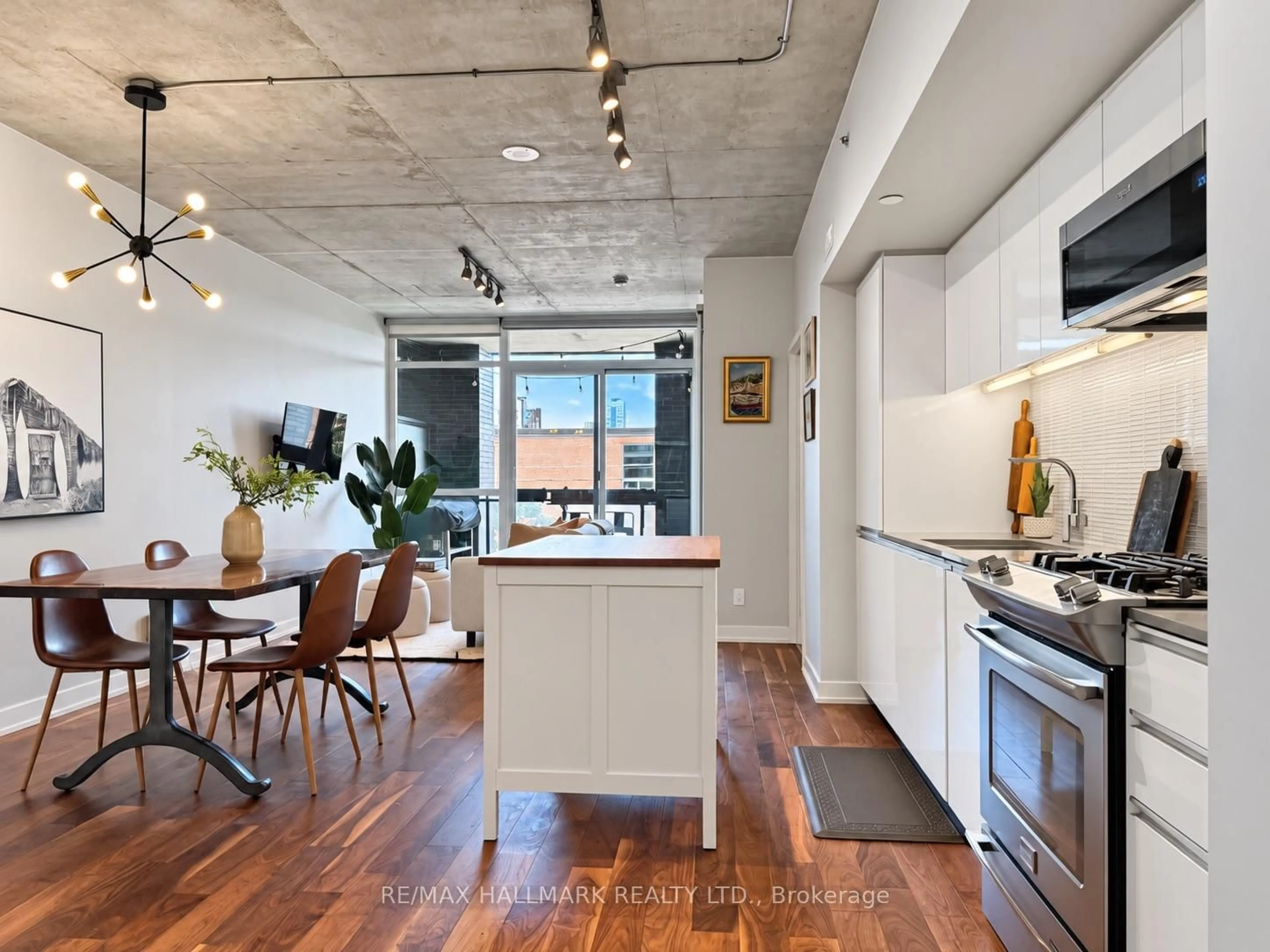 Open concept kitchen, cement floor for 1190 Dundas St #219, Toronto Ontario M4M 0C5