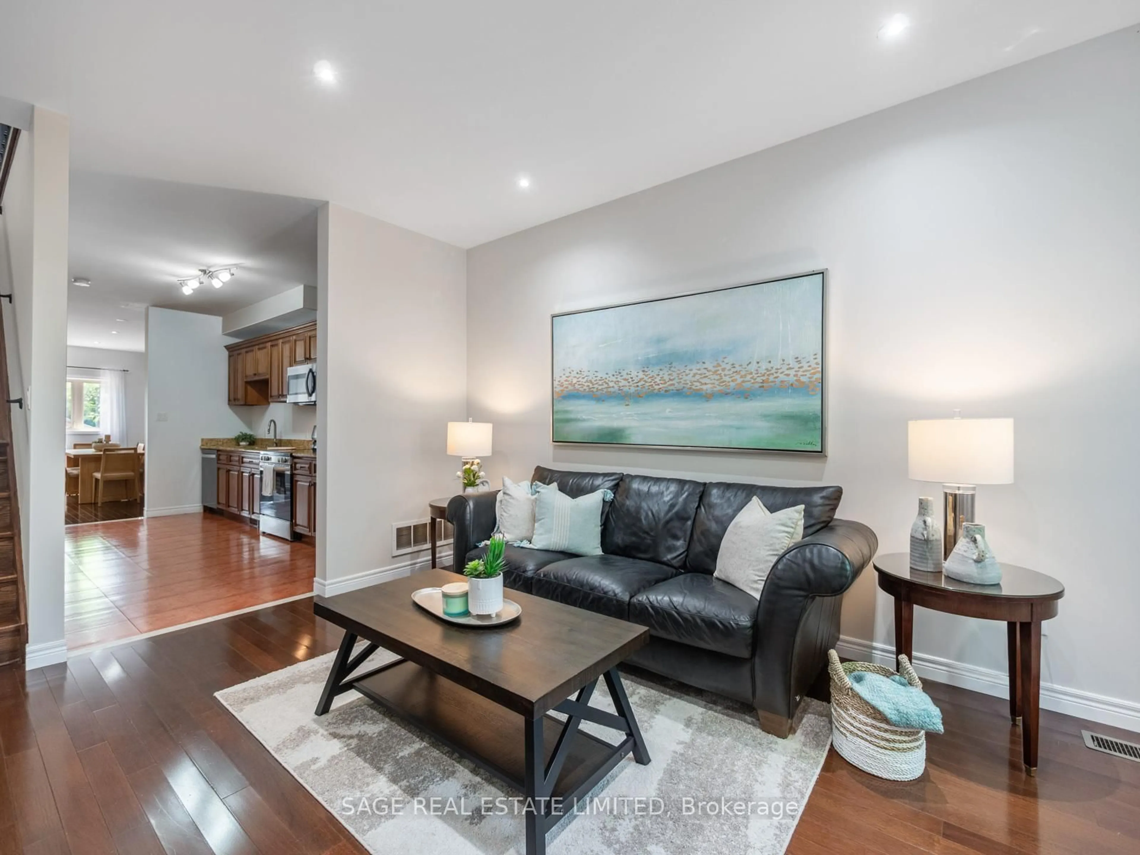 Living room with furniture, wood/laminate floor for 251A Chisholm Ave, Toronto Ontario M4C 4W5