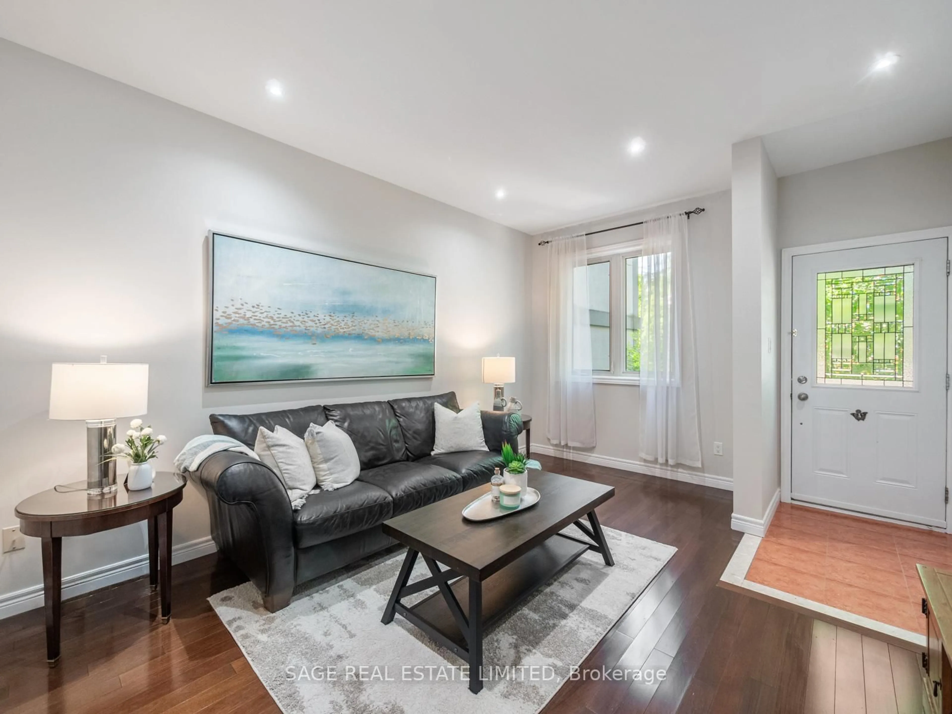 Living room with furniture, wood/laminate floor for 251A Chisholm Ave, Toronto Ontario M4C 4W5