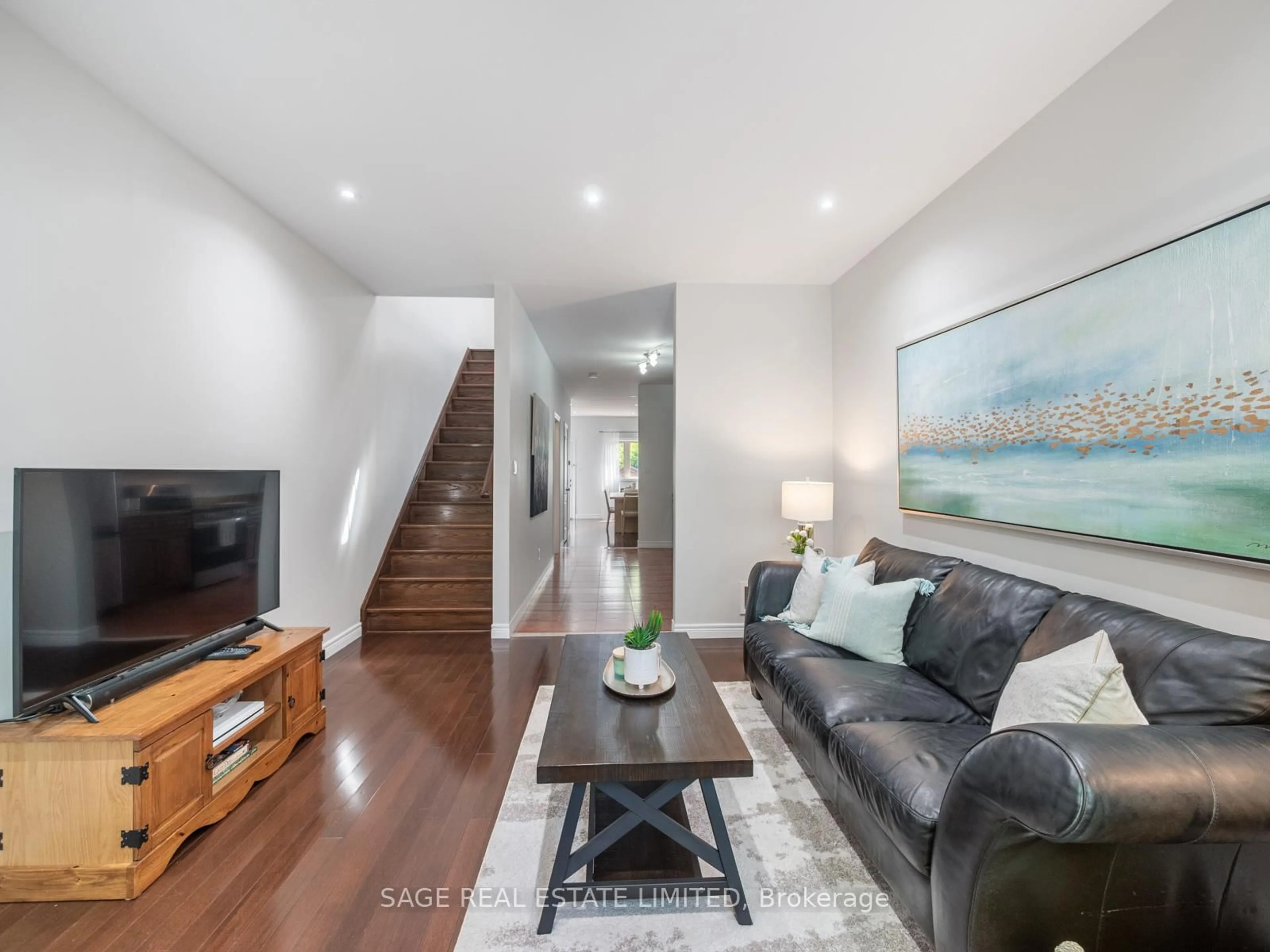 Living room with furniture, wood/laminate floor for 251A Chisholm Ave, Toronto Ontario M4C 4W5