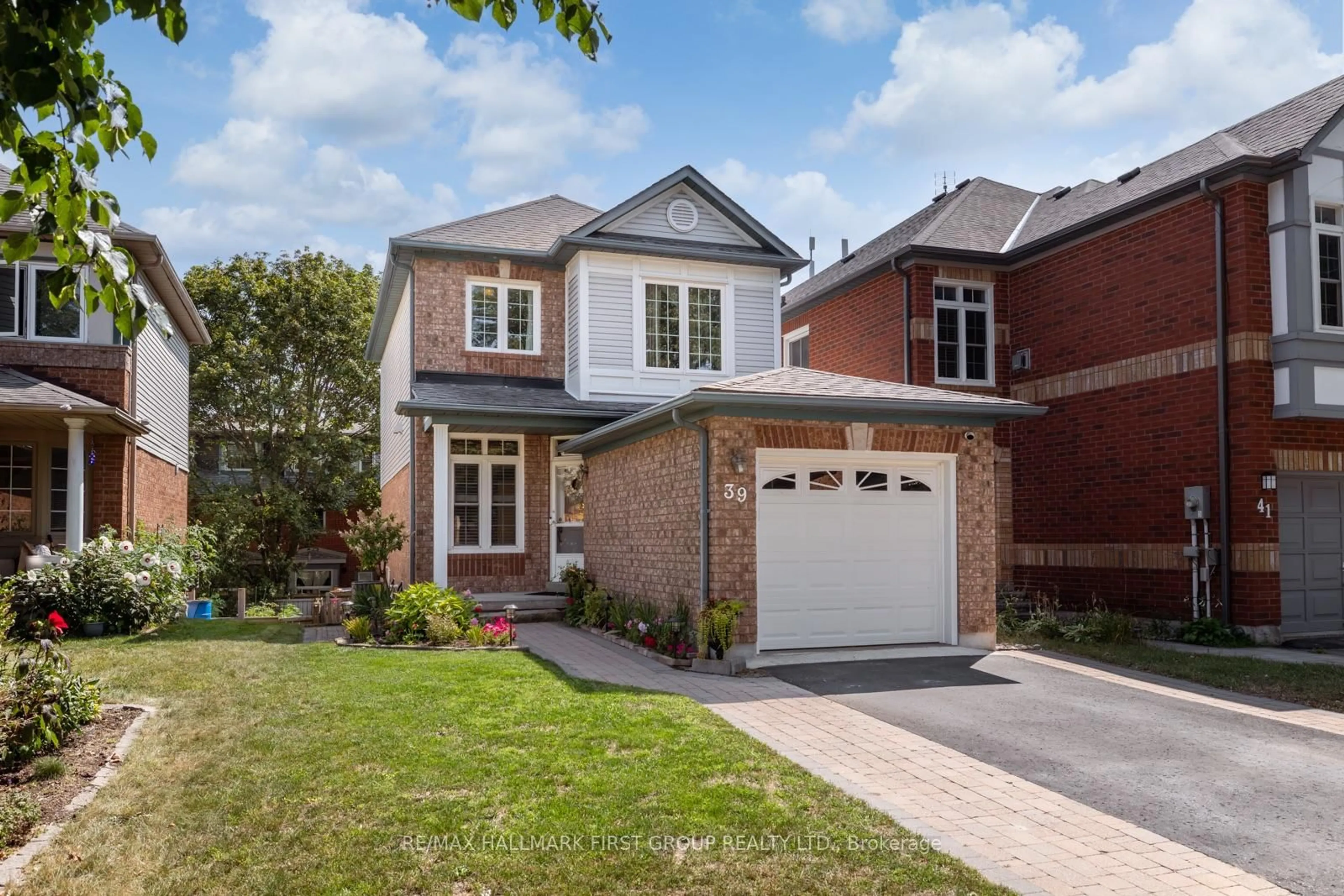 Home with brick exterior material, street for 39 Bach Ave, Whitby Ontario L1R 2L1