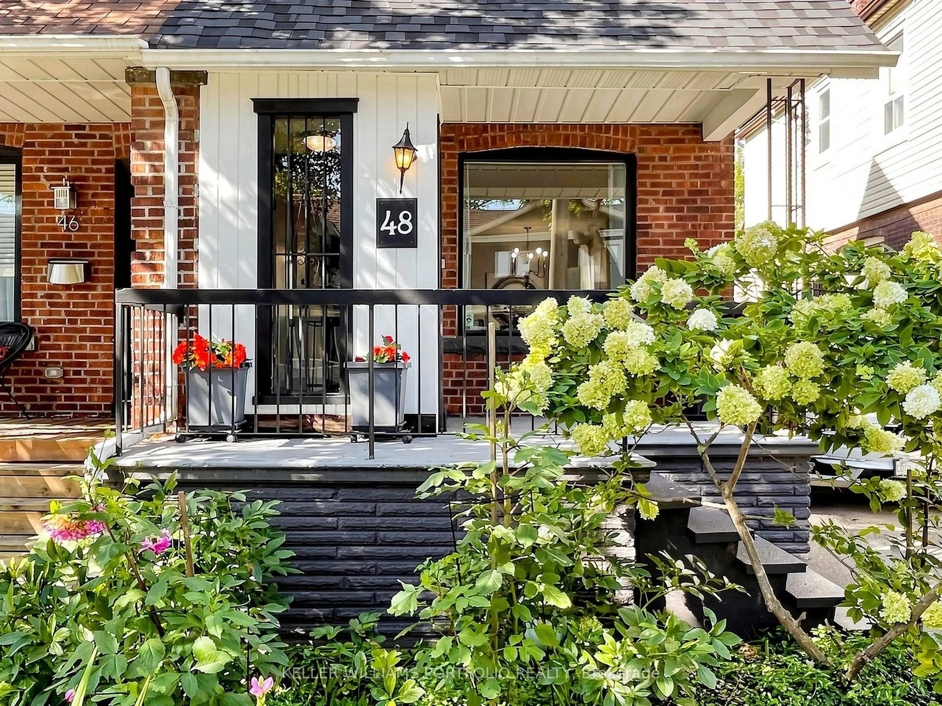 Home with brick exterior material, street for 48 Hiltz Ave, Toronto Ontario M4L 2N5
