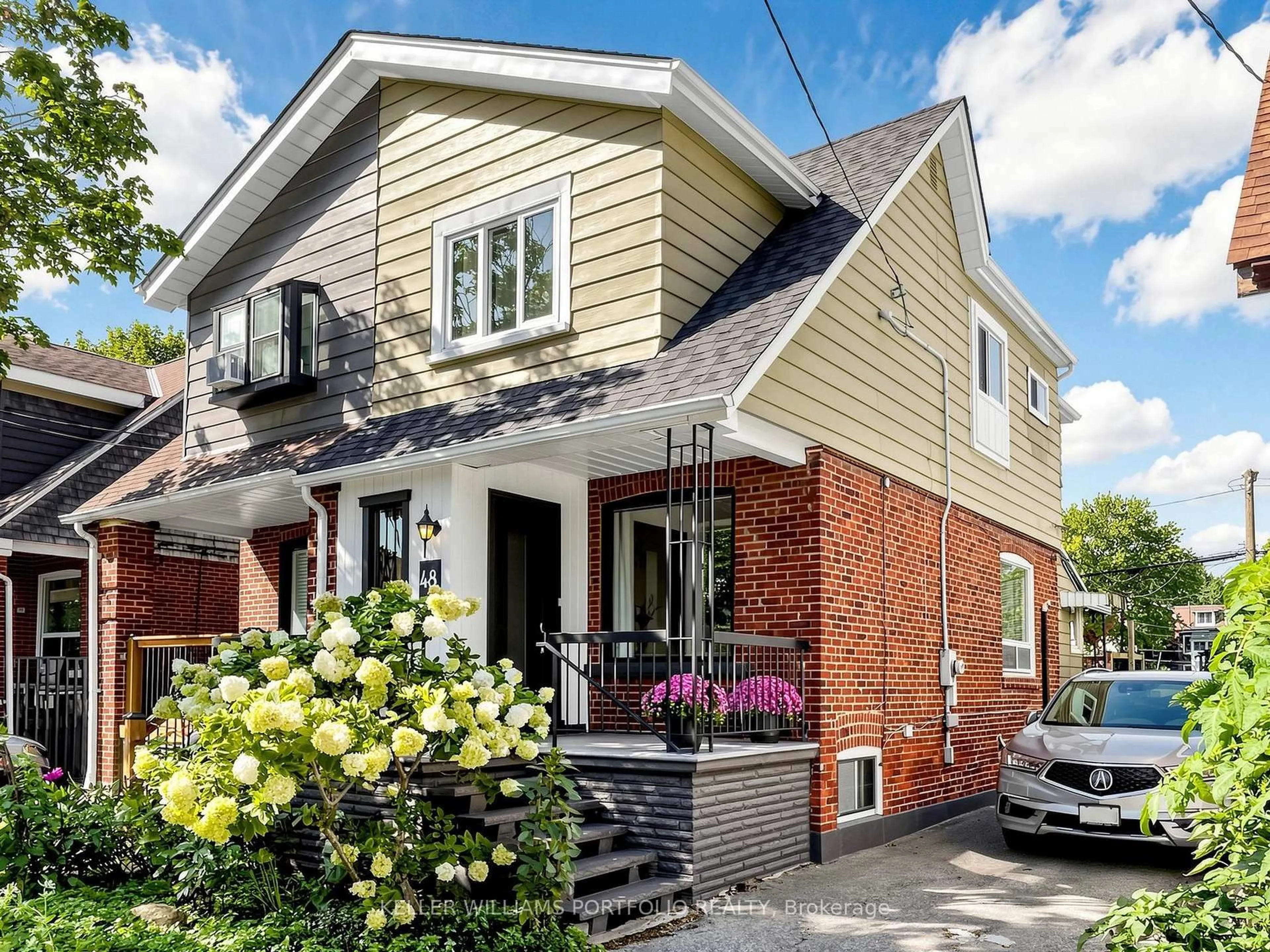 Home with brick exterior material, street for 48 Hiltz Ave, Toronto Ontario M4L 2N5