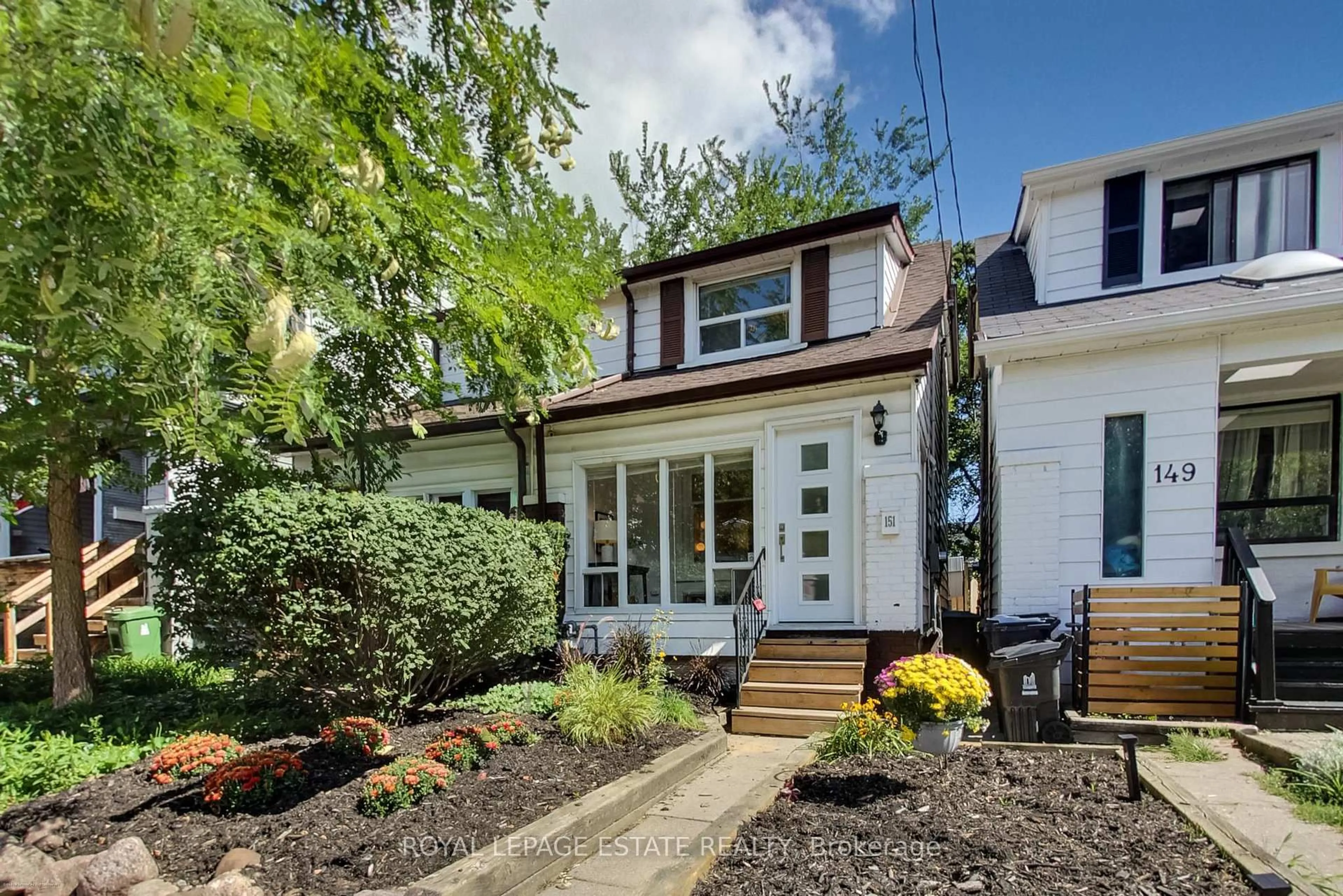 Home with vinyl exterior material, street for 151 Drayton Ave, Toronto Ontario M4C 3M1