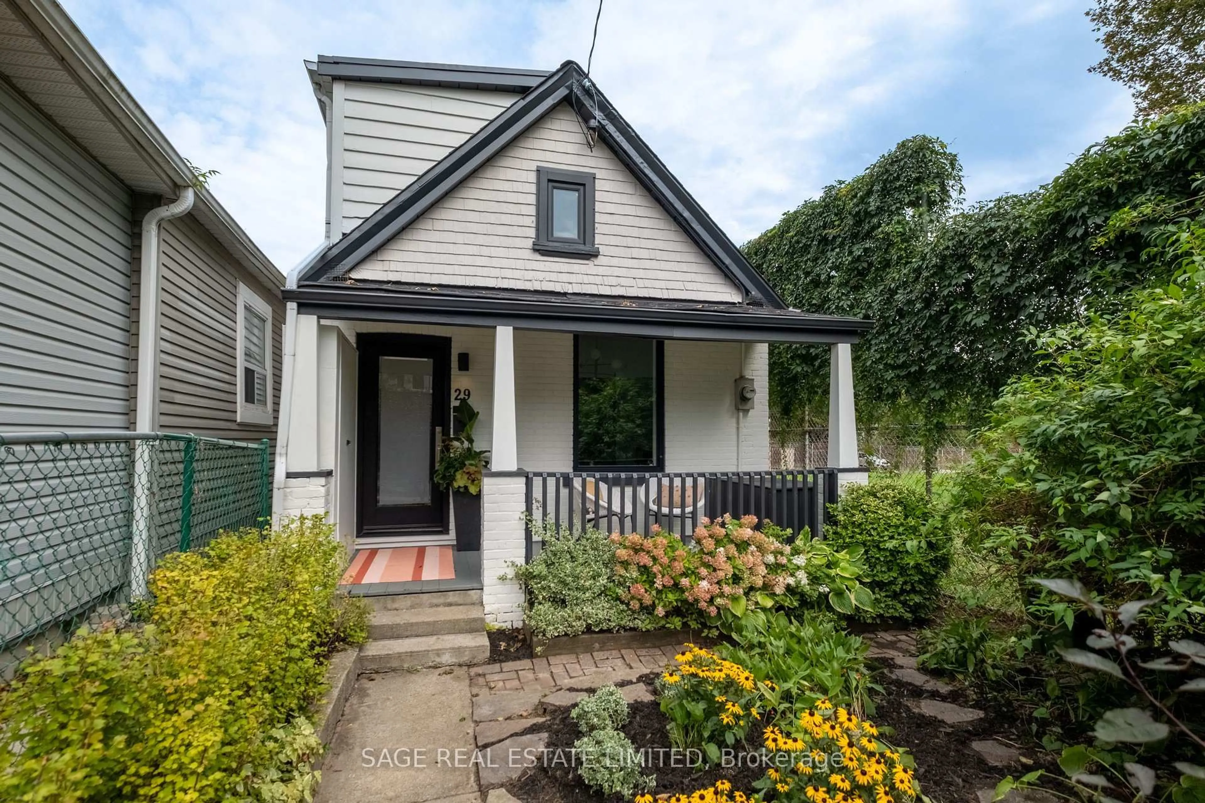 Home with vinyl exterior material, street for 29 Bushell Ave, Toronto Ontario M4M 3B8