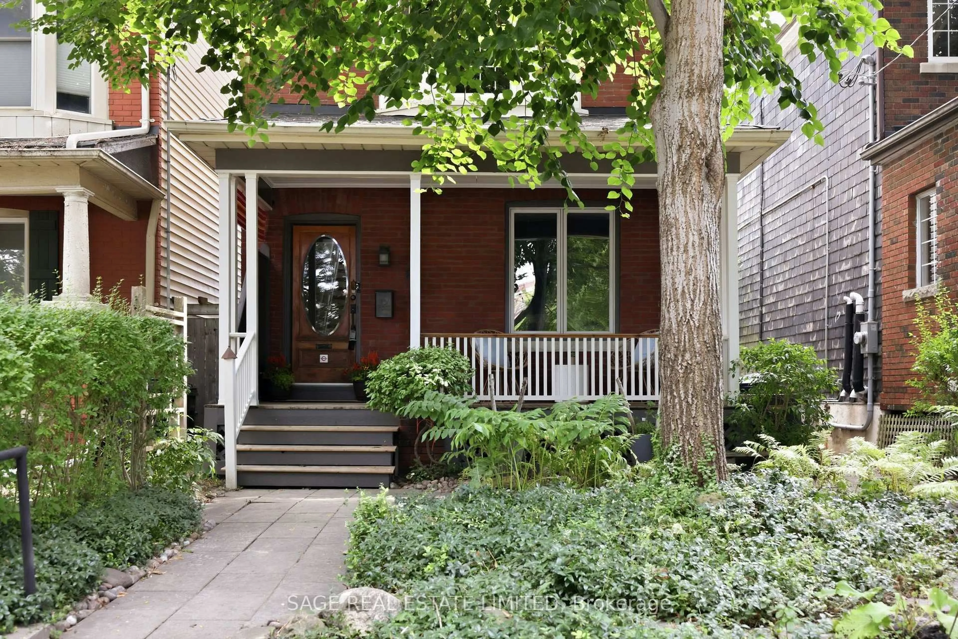 Home with brick exterior material, street for 81 Woodfield Rd, Toronto Ontario M4L 2W5