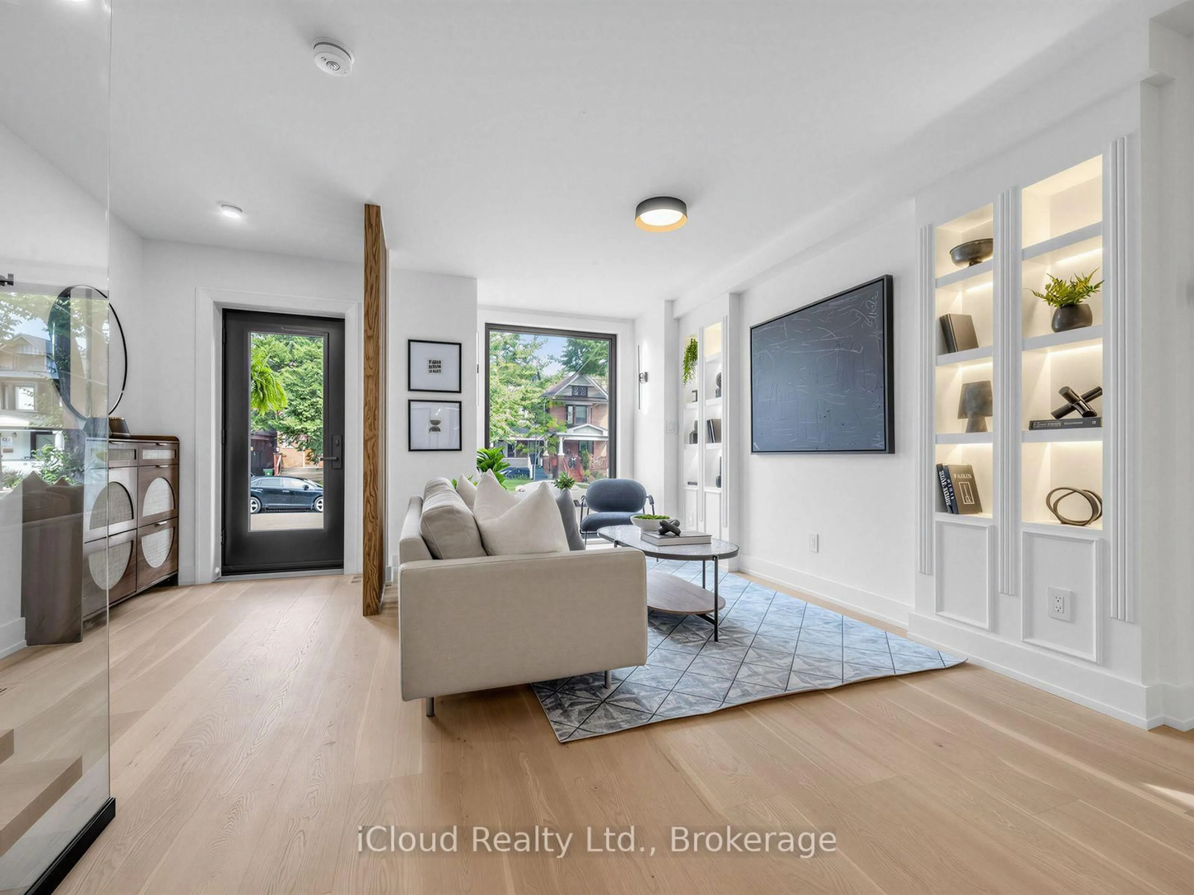 Living room with furniture, wood/laminate floor for 96 Woodycrest Ave, Toronto Ontario M4J 3A9