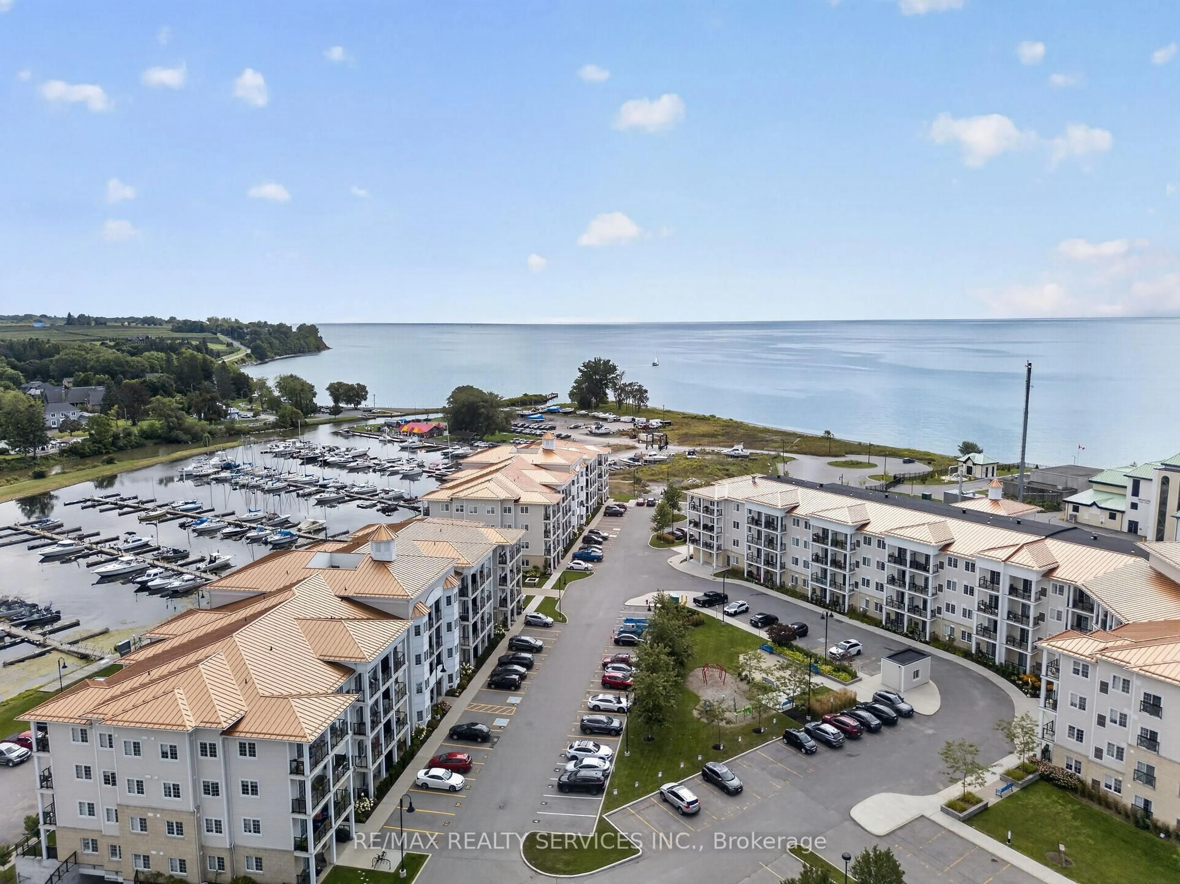 A pic from outside/outdoor area/front of a property/back of a property/a pic from drone, water/lake/river/ocean view for 50 Lakebreeze Dr #129, Clarington Ontario L1B 0V9