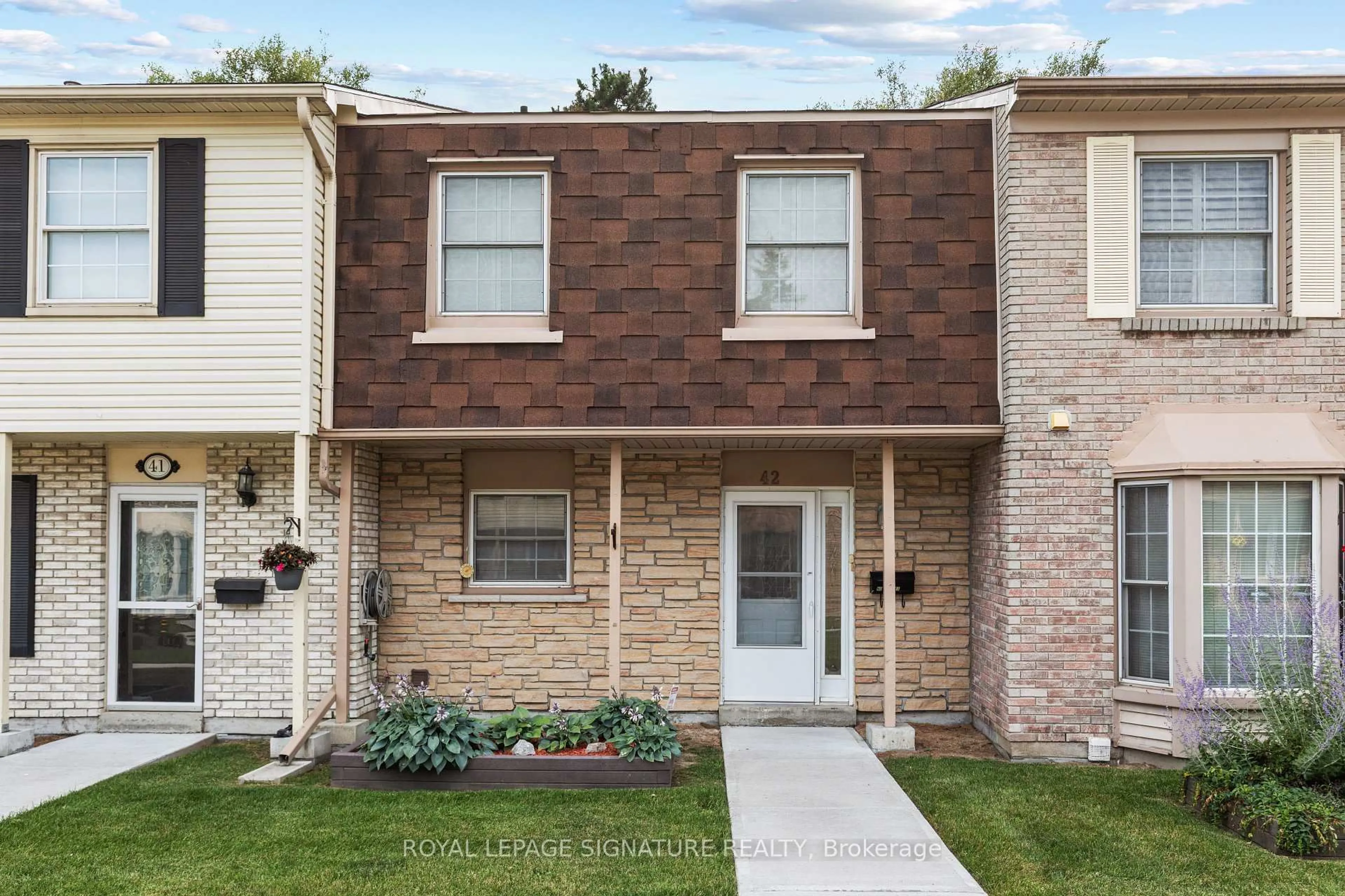 Home with brick exterior material, street for 580 Eyer Dr #42, Pickering Ontario L1W 3B7
