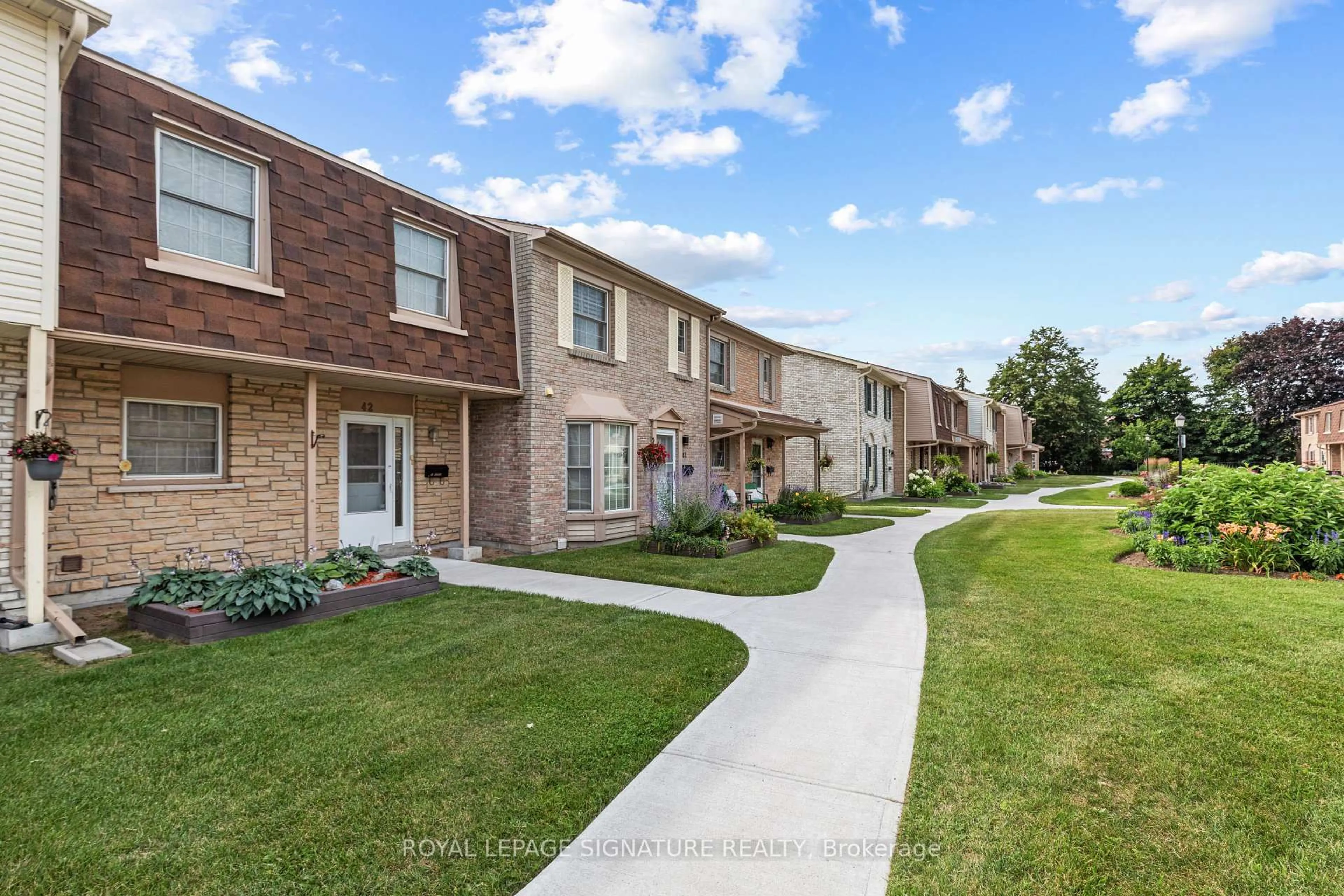 Home with brick exterior material, street for 580 Eyer Dr #42, Pickering Ontario L1W 3B7