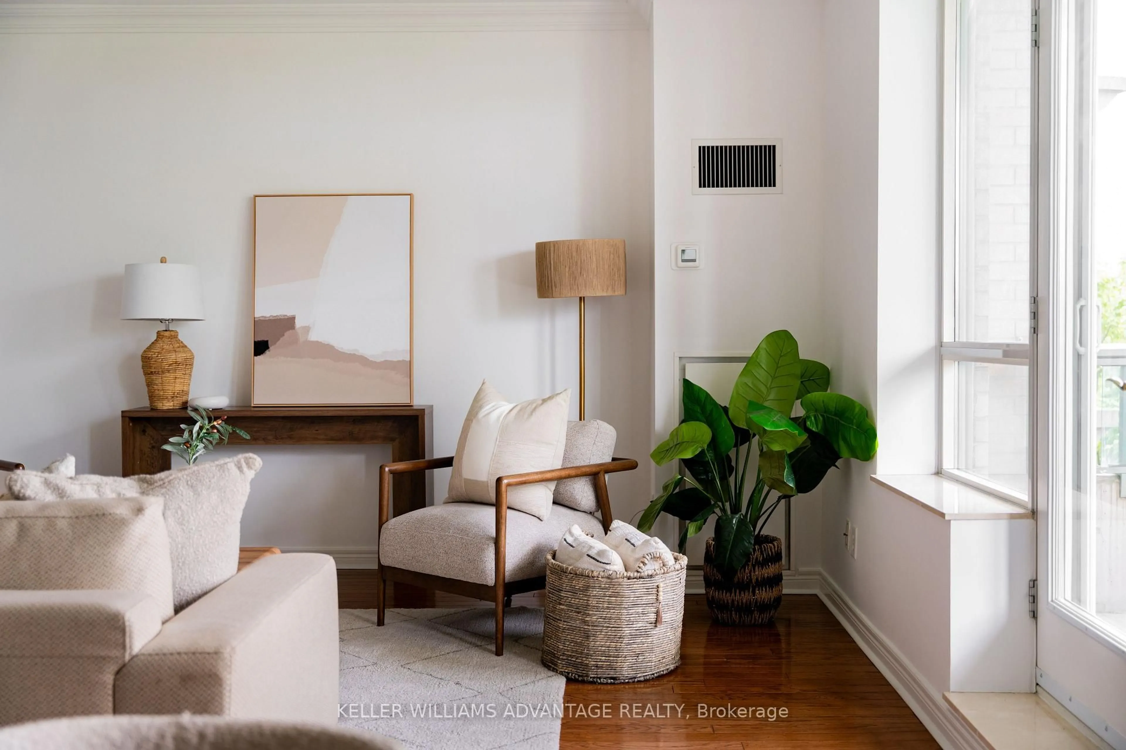 Living room with furniture, wood/laminate floor for 9 Boardwalk Dr #321, Toronto Ontario M4L 6T1