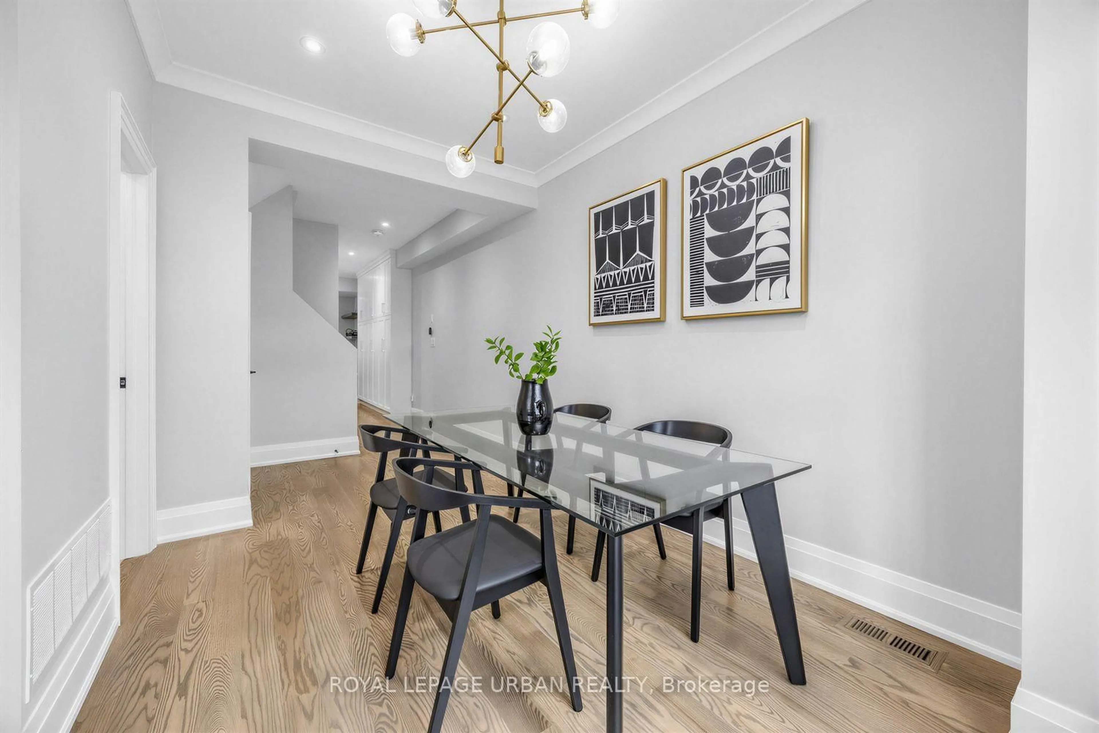 Dining room, wood/laminate floor for 287 Glebemount Ave, Toronto Ontario M4C 3T9