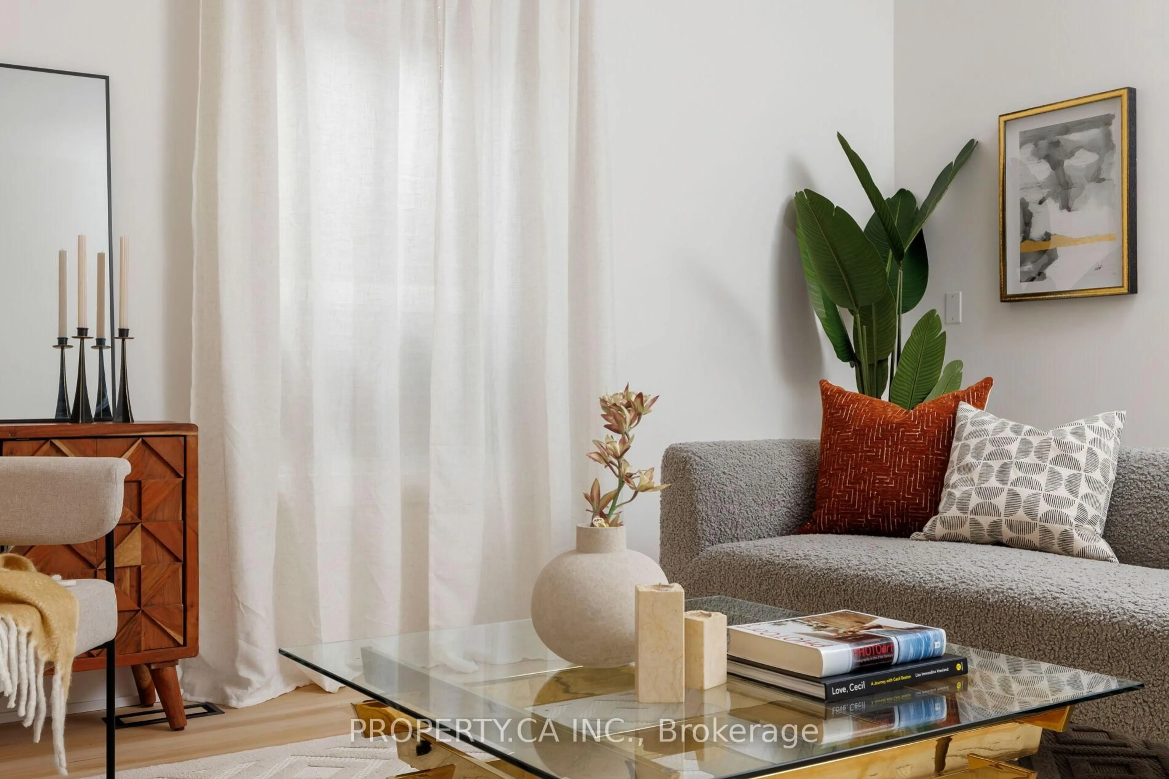 Living room with furniture, wood/laminate floor for 332 Woodfield Rd, Toronto Ontario M4L 2X1