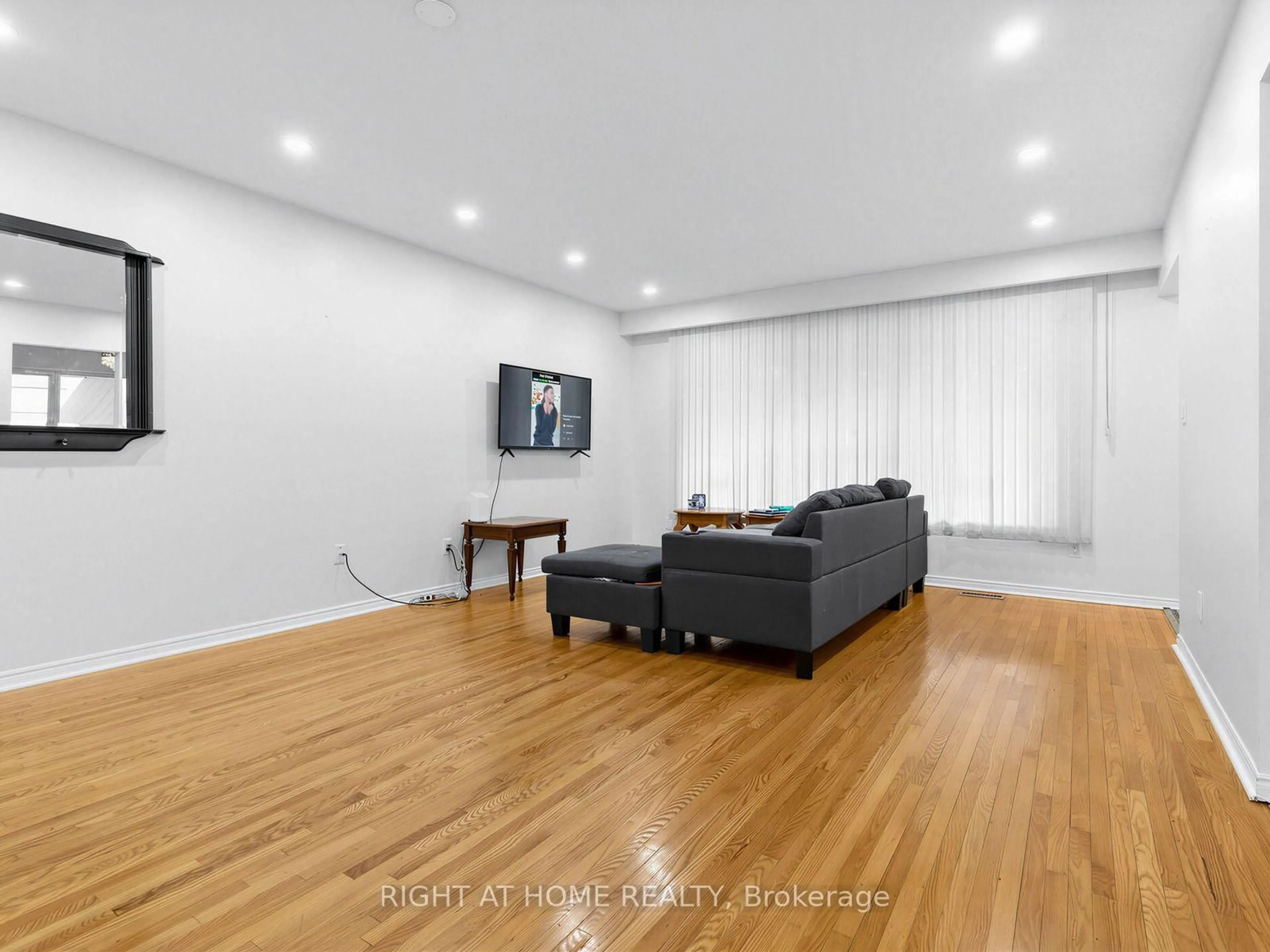 Living room with furniture, wood/laminate floor for 346 Lorindale Dr, Oshawa Ontario L1H 6X4