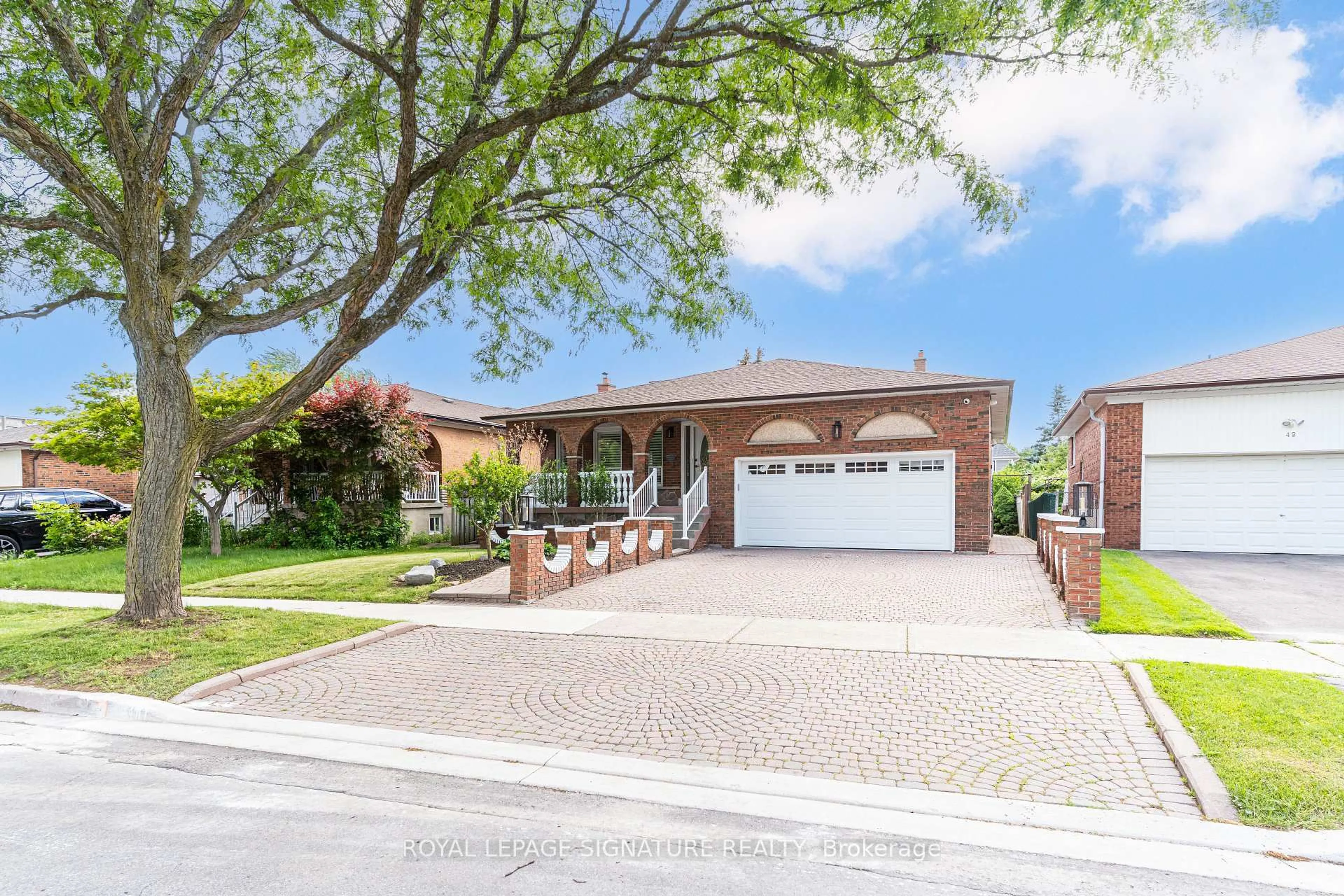 Home with brick exterior material, street for 40 Beamsville Dr, Toronto Ontario M1T 3S2