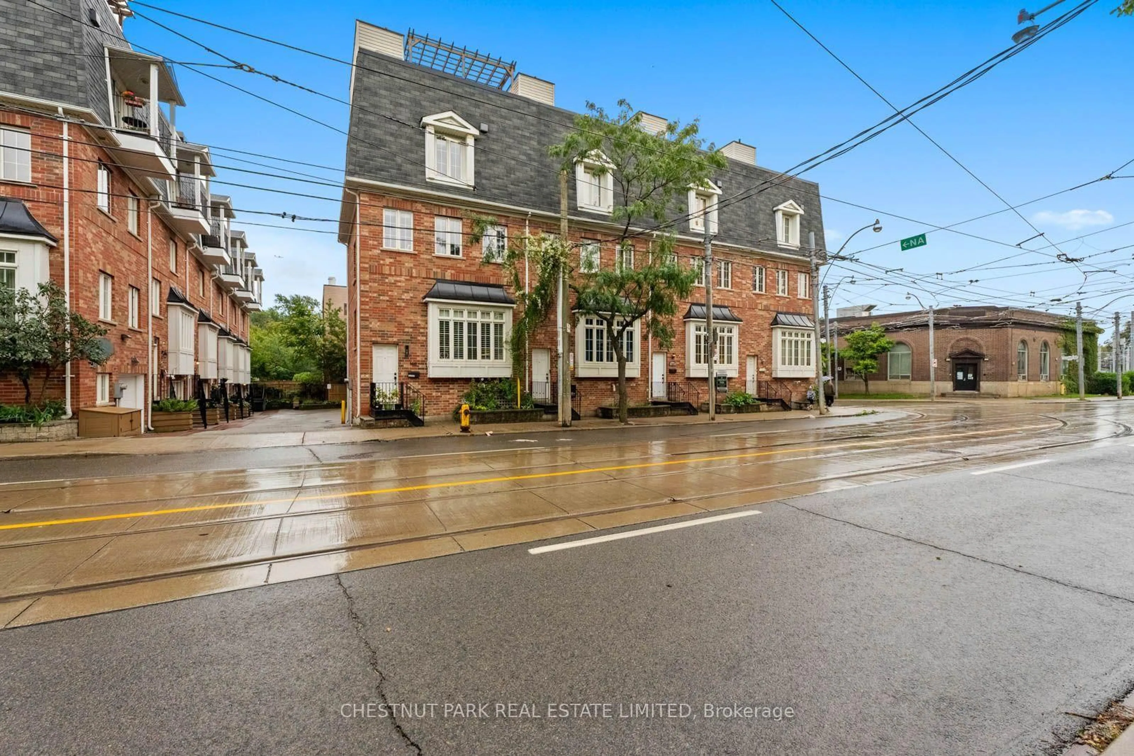 Home with brick exterior material, street for 1437 Queen St, Toronto Ontario M4L 1E2