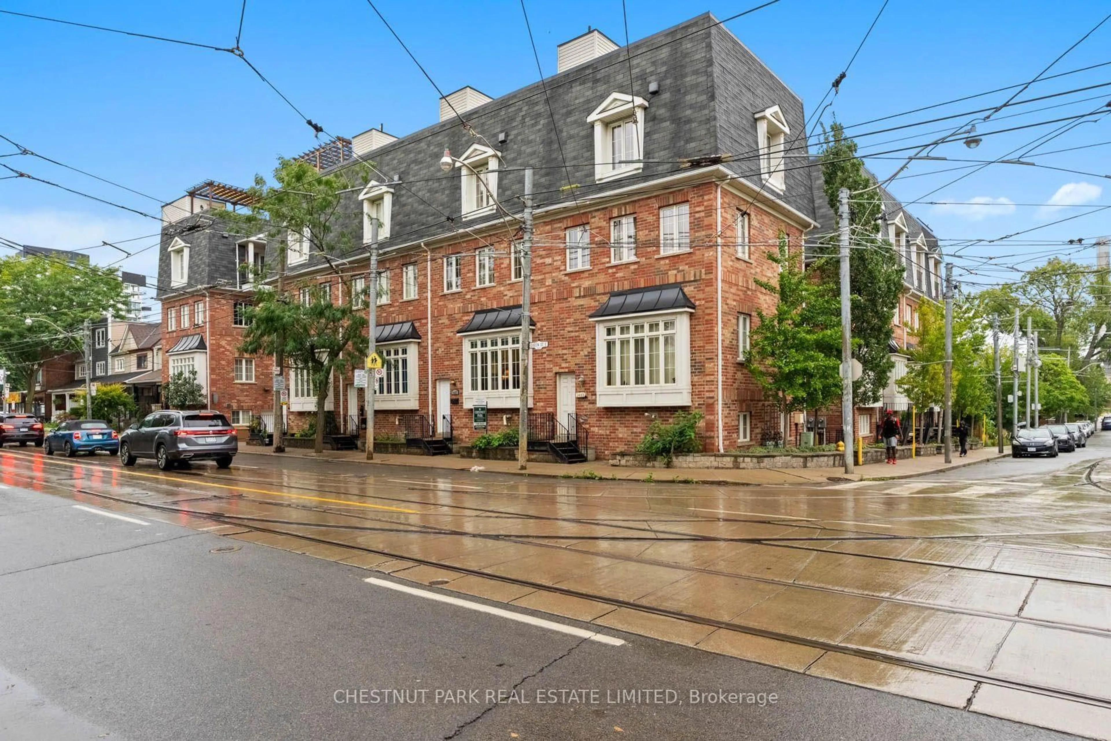 Home with brick exterior material, street for 1437 Queen St, Toronto Ontario M4L 1E2