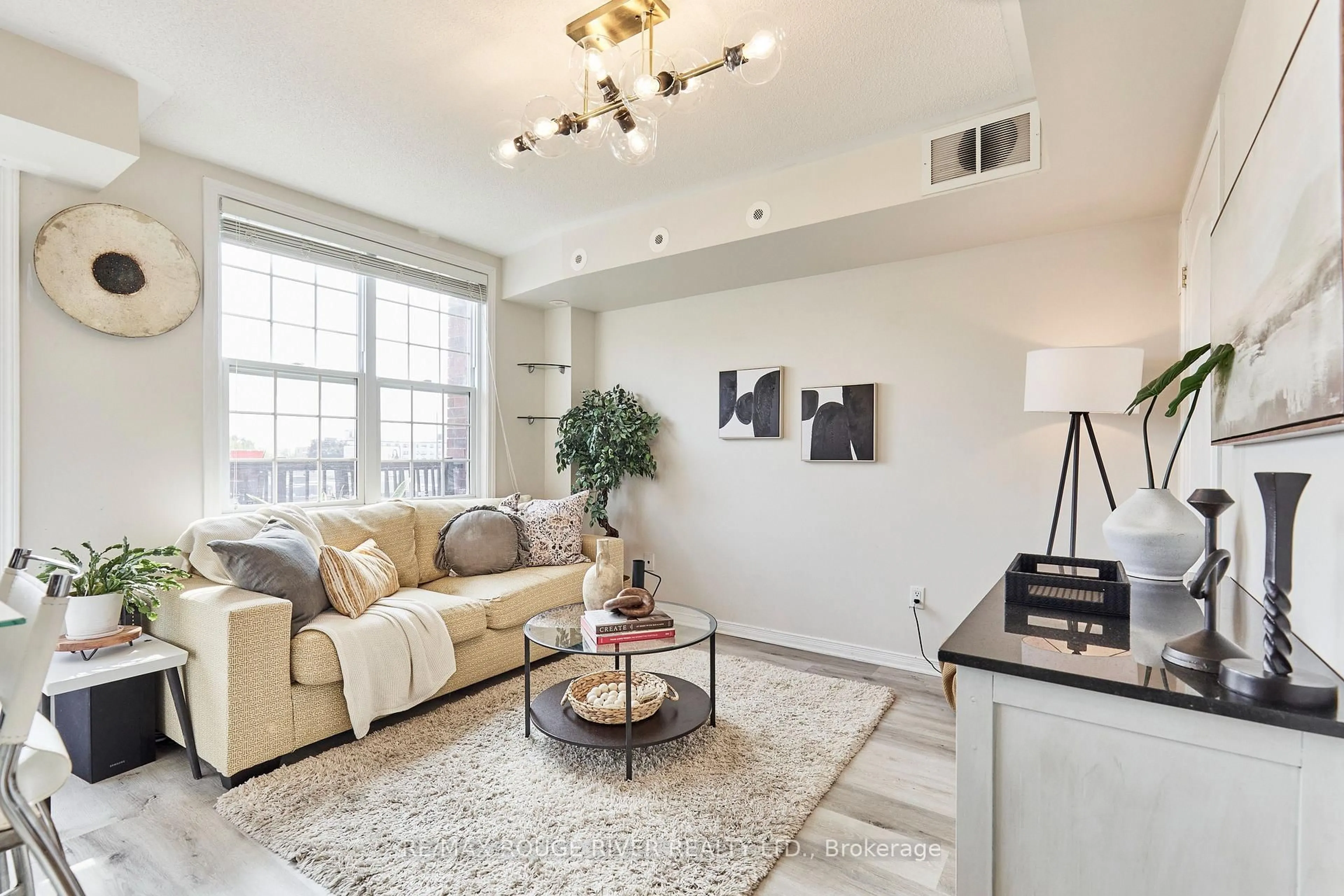 Living room with furniture, unknown for 25 Strangford Lane #312, Toronto Ontario M1L 0E5