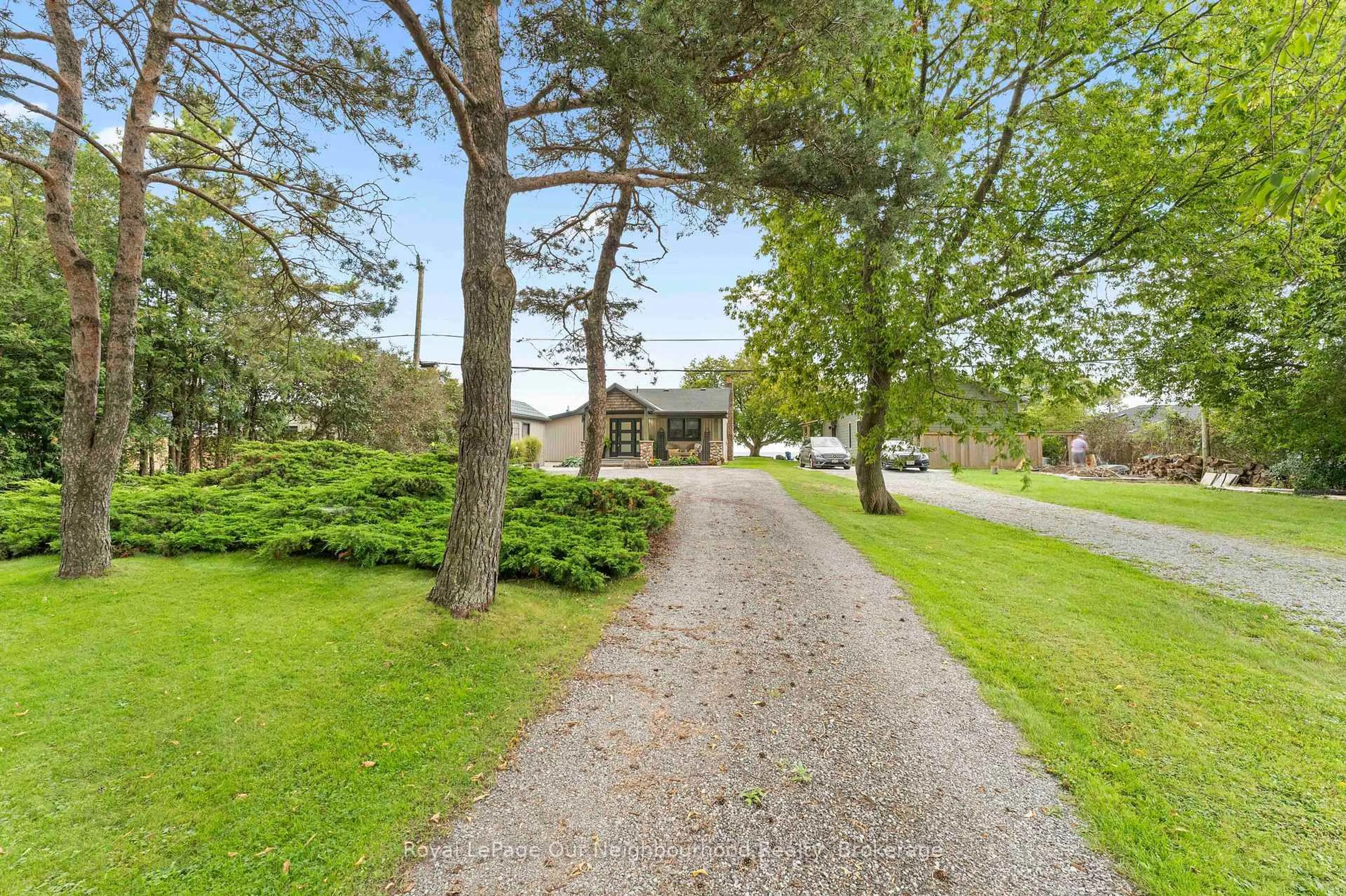 A pic from outside/outdoor area/front of a property/back of a property/a pic from drone, street for 121 Cedar Crest Beach Rd, Clarington Ontario L1C 3K3
