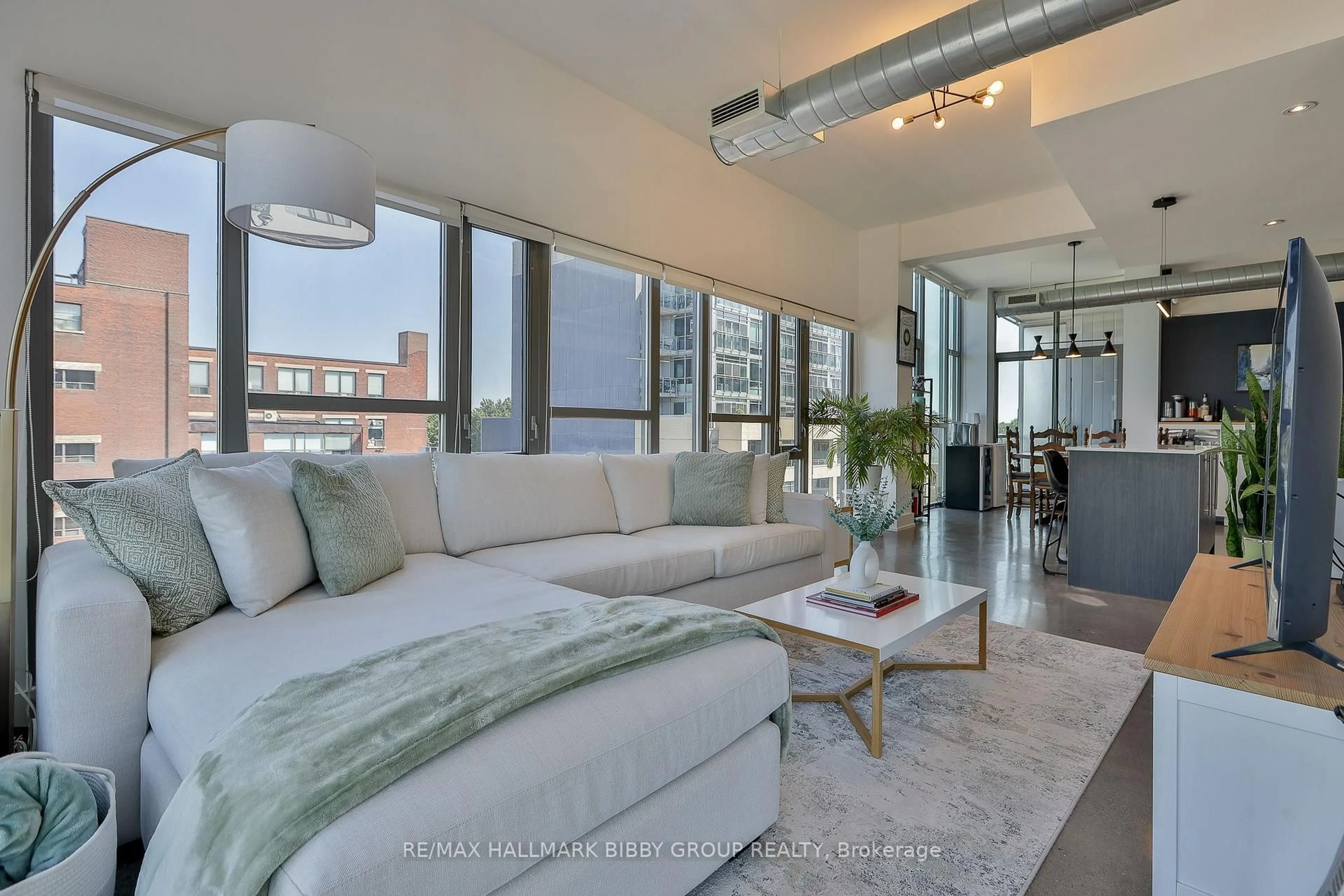 Living room with furniture, unknown for 625 Queen St #409, Toronto Ontario M4M 1G4