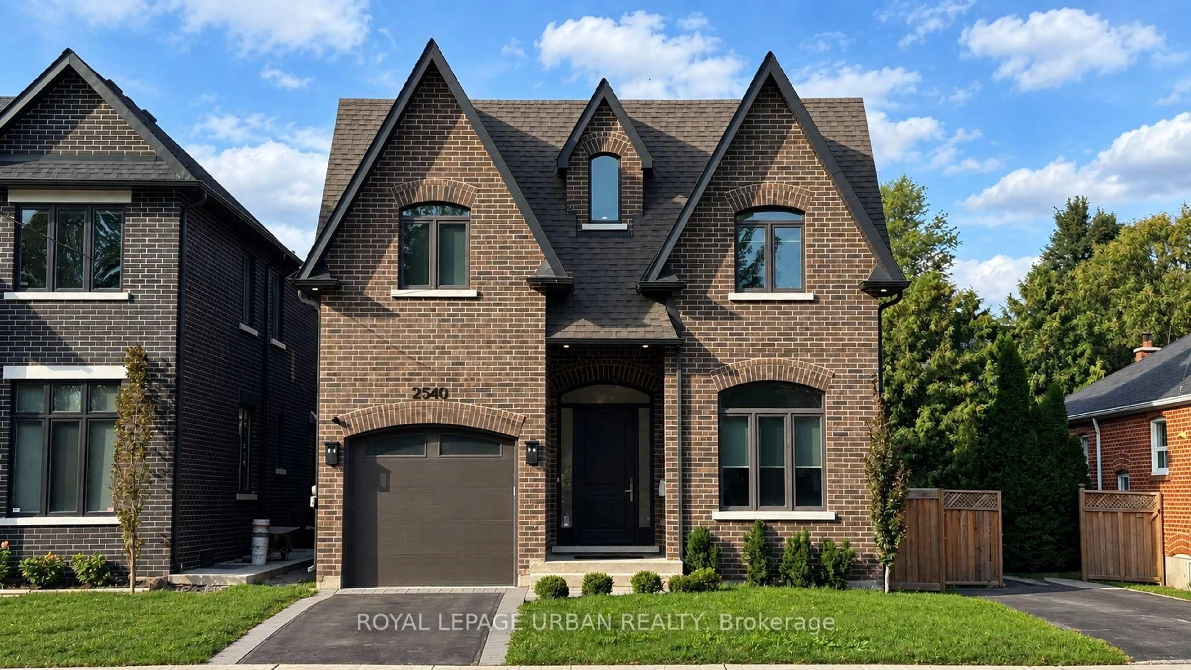 Home with brick exterior material, street for 2540 St Clair Ave, Toronto Ontario M4B 1M1