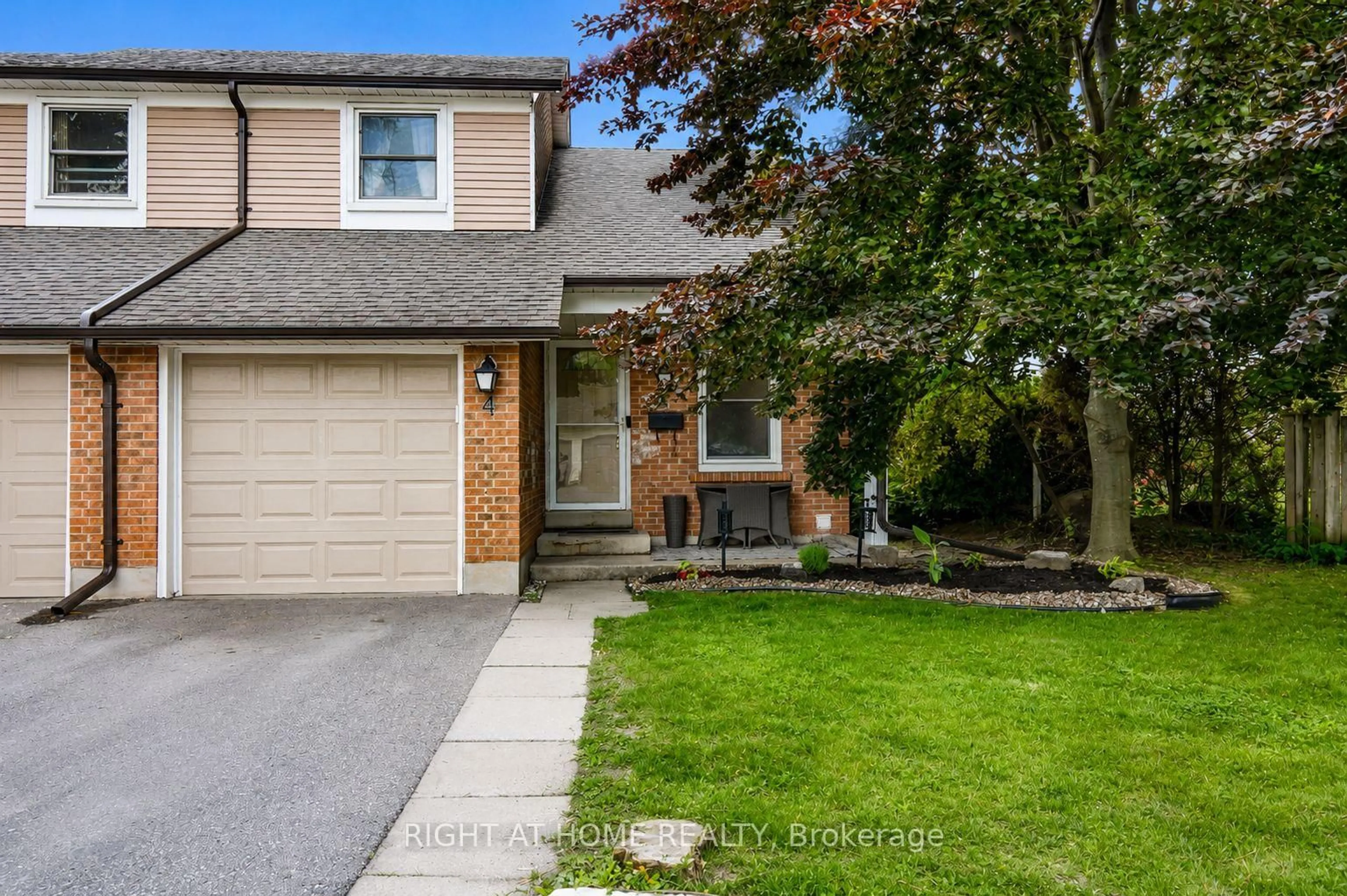Home with vinyl exterior material, street for 1055 Central Park Blvd ##4, Oshawa Ontario L1G 7M4