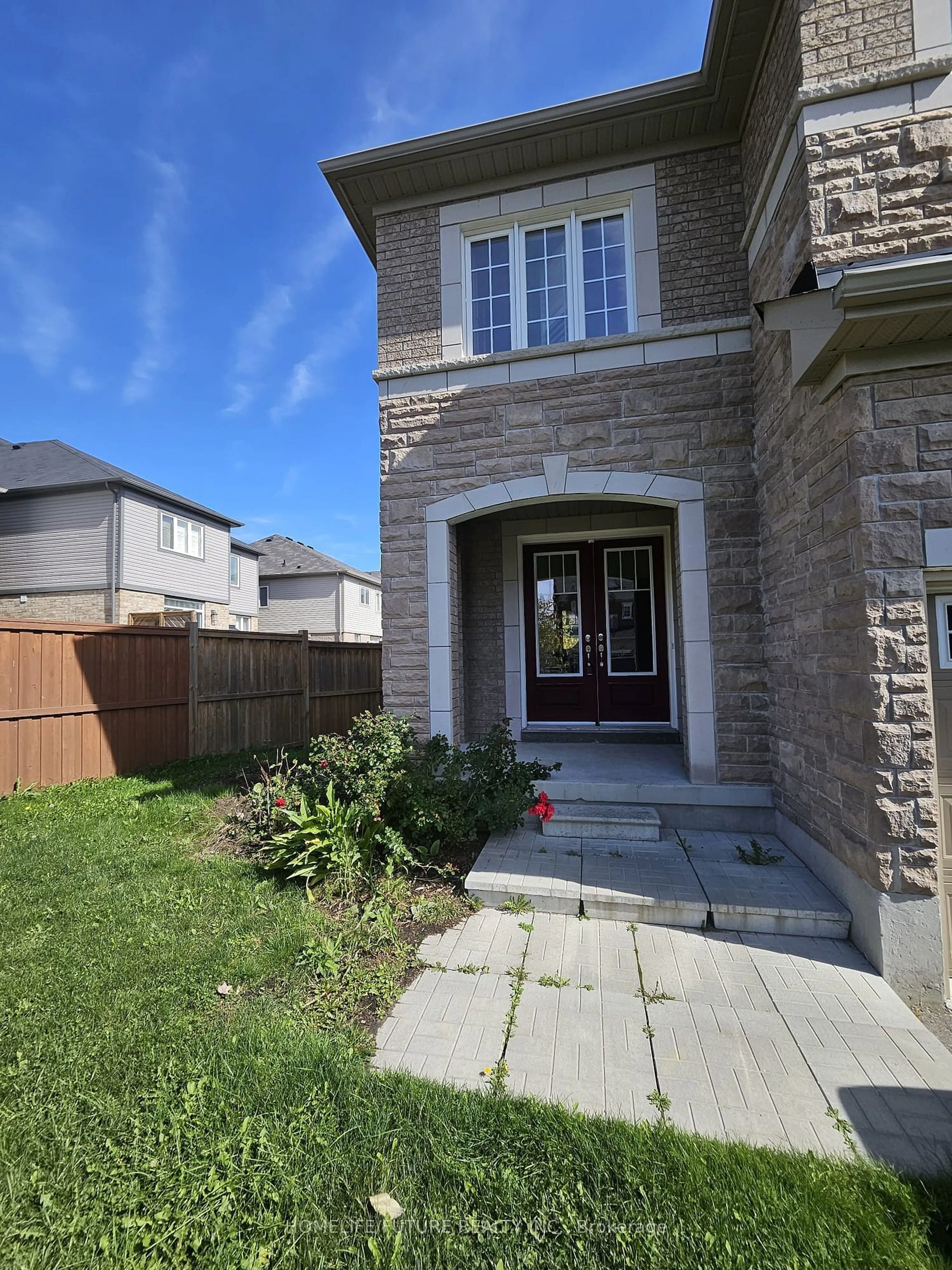 Frontside or backside of a home, the fenced backyard for 56 Bonathon Cres, Clarington Ontario L1C 5B9