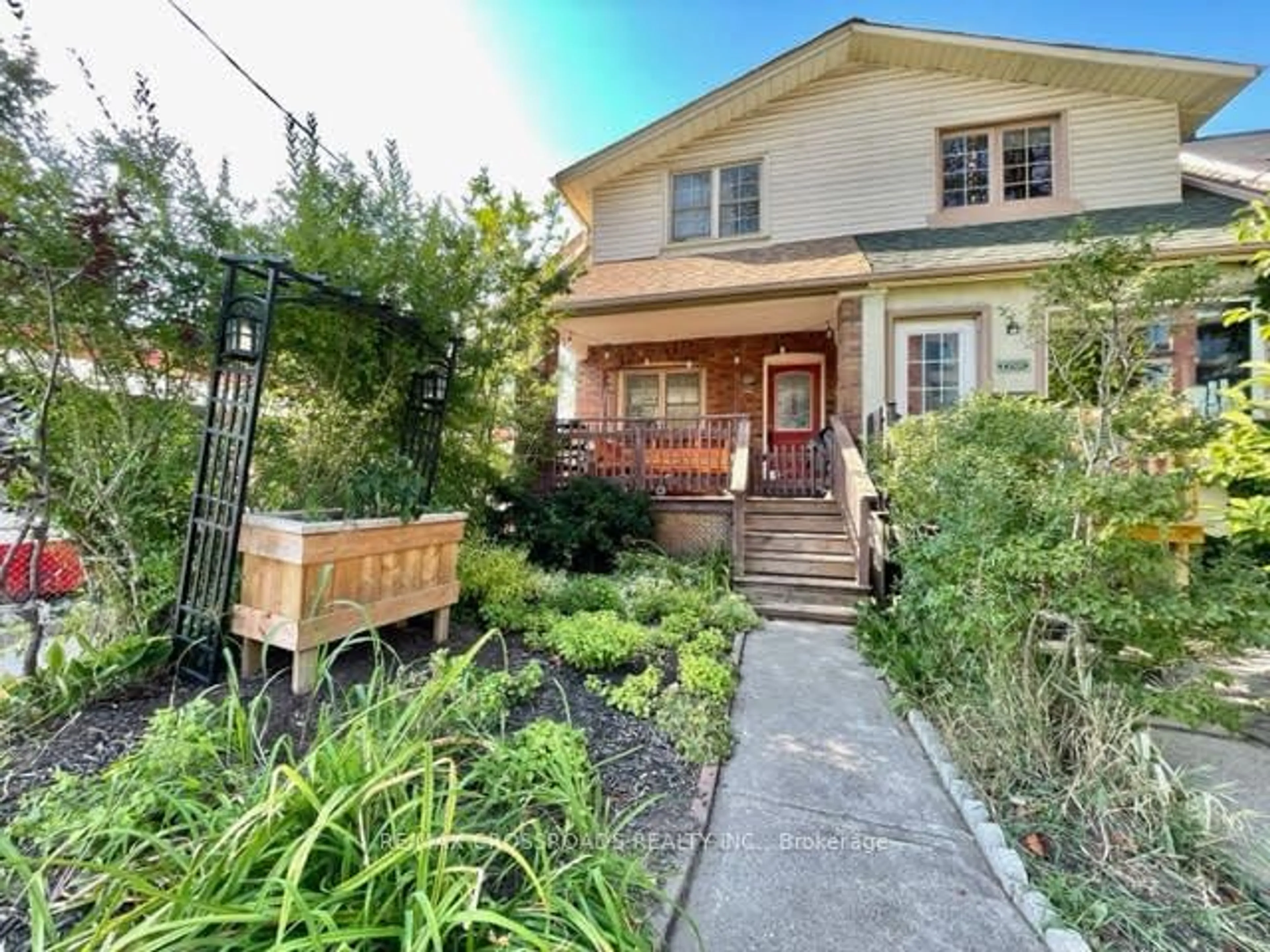 Frontside or backside of a home for 1756 Queen St, Toronto Ontario M4L 1G7
