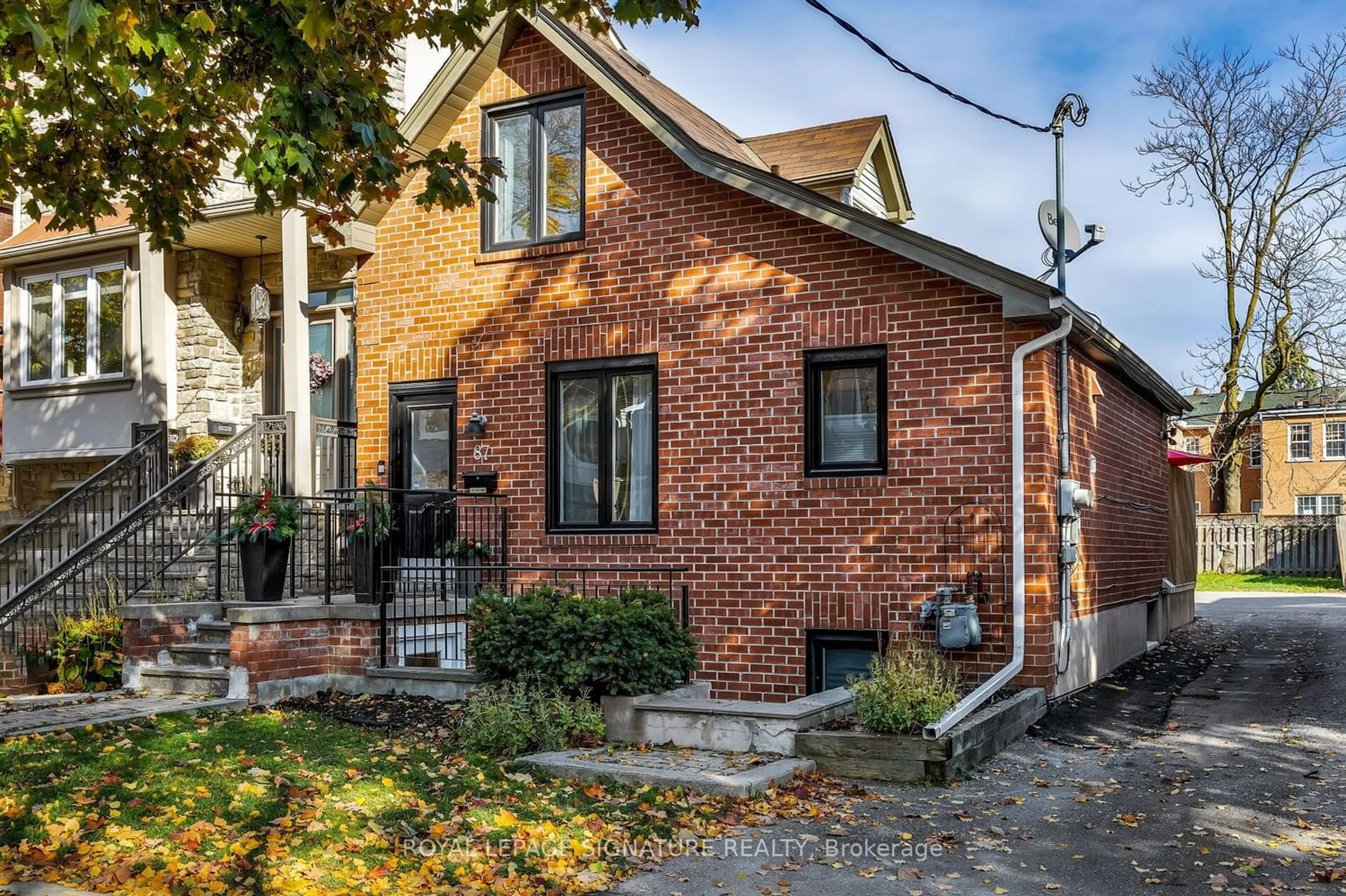 Home with brick exterior material for 87 Rhodes Ave, Toronto Ontario M4L 2Z8