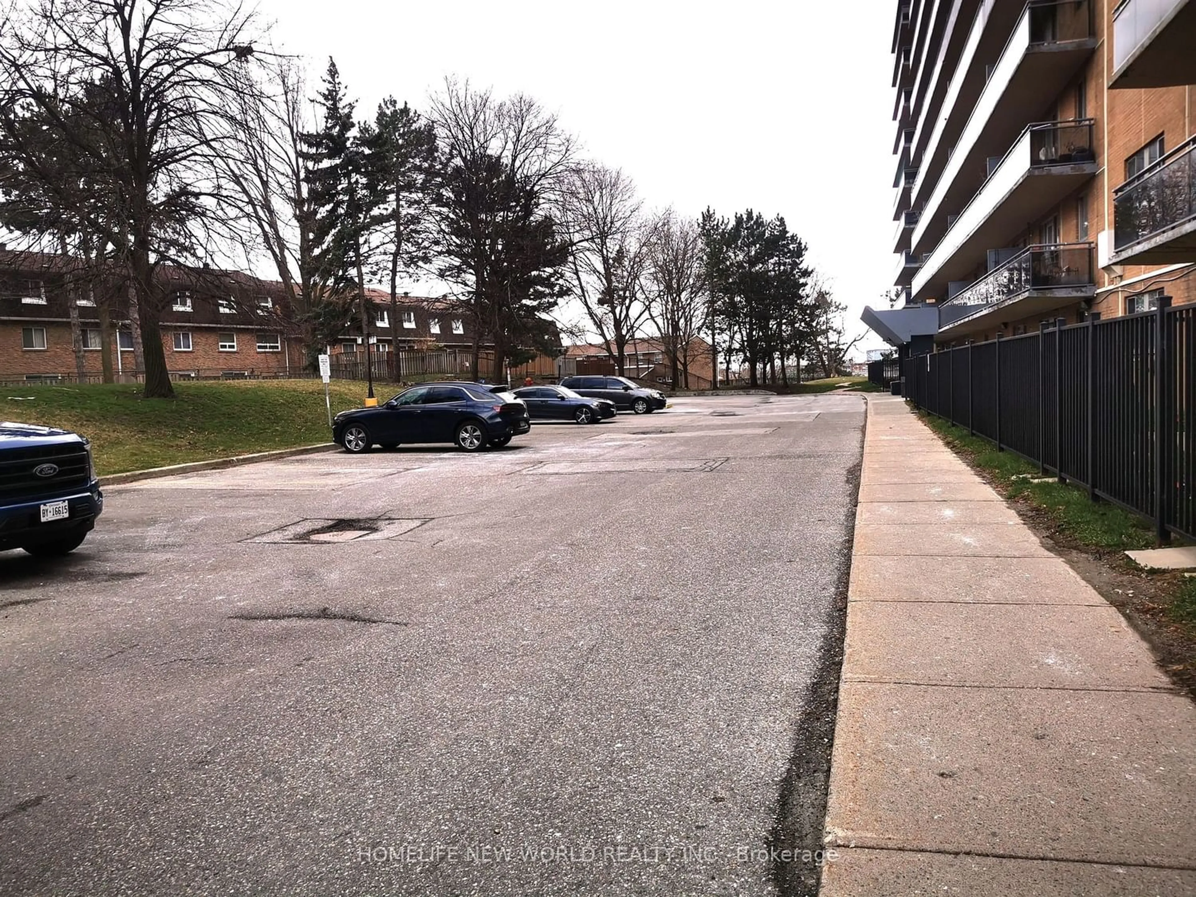 A view of a street for 100 Dundalk Dr #214, Toronto Ontario M1P 4V2