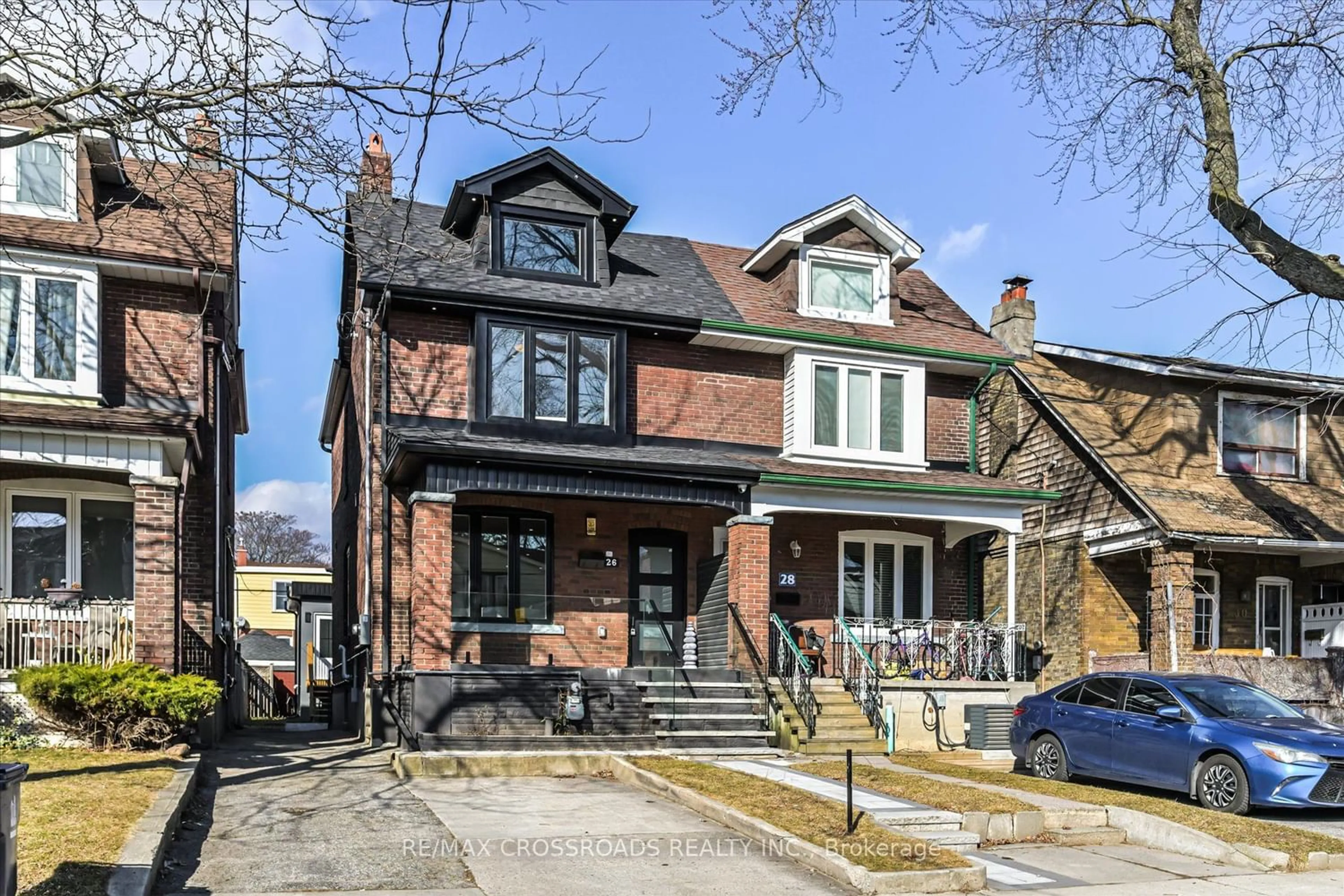 Home with brick exterior material for 26 Glebeholme Blvd, Toronto Ontario M4J 1S4