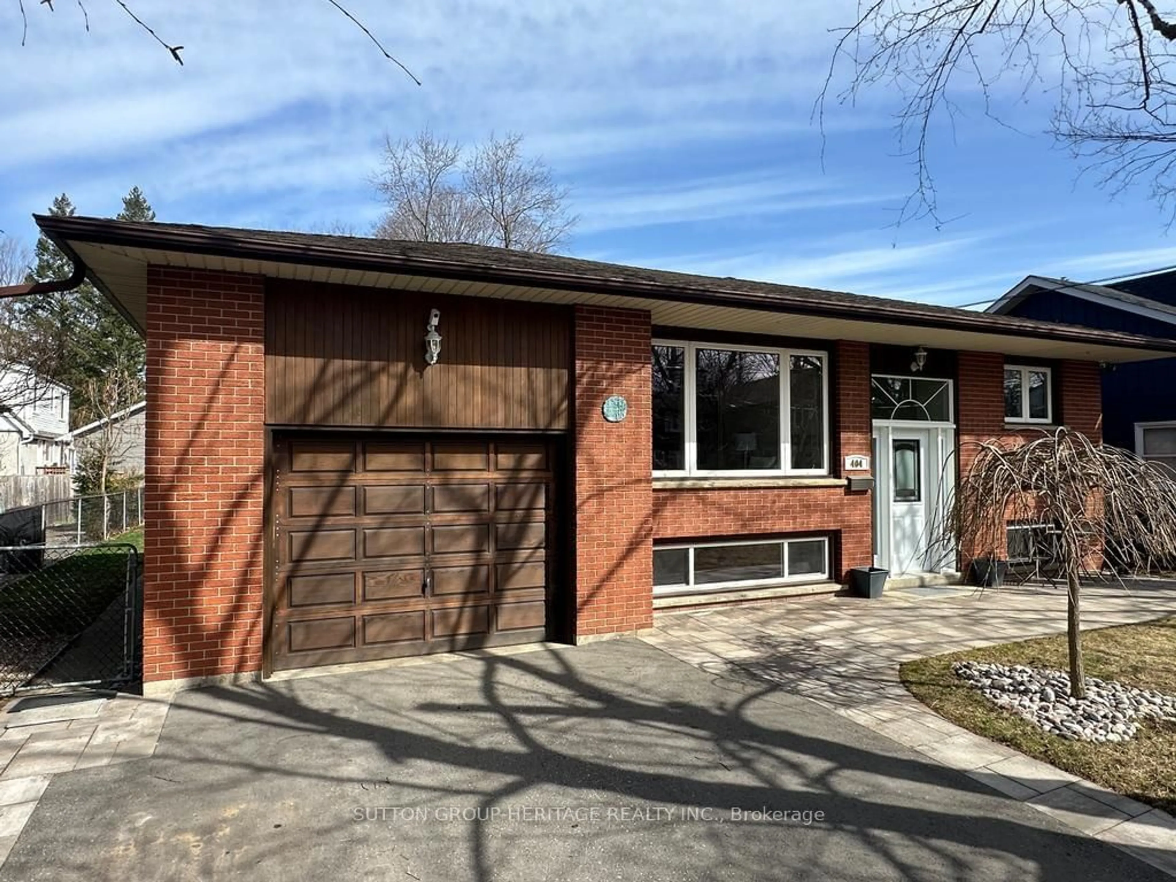 Home with brick exterior material for 404 Trent St, Whitby Ontario L1N 1M5