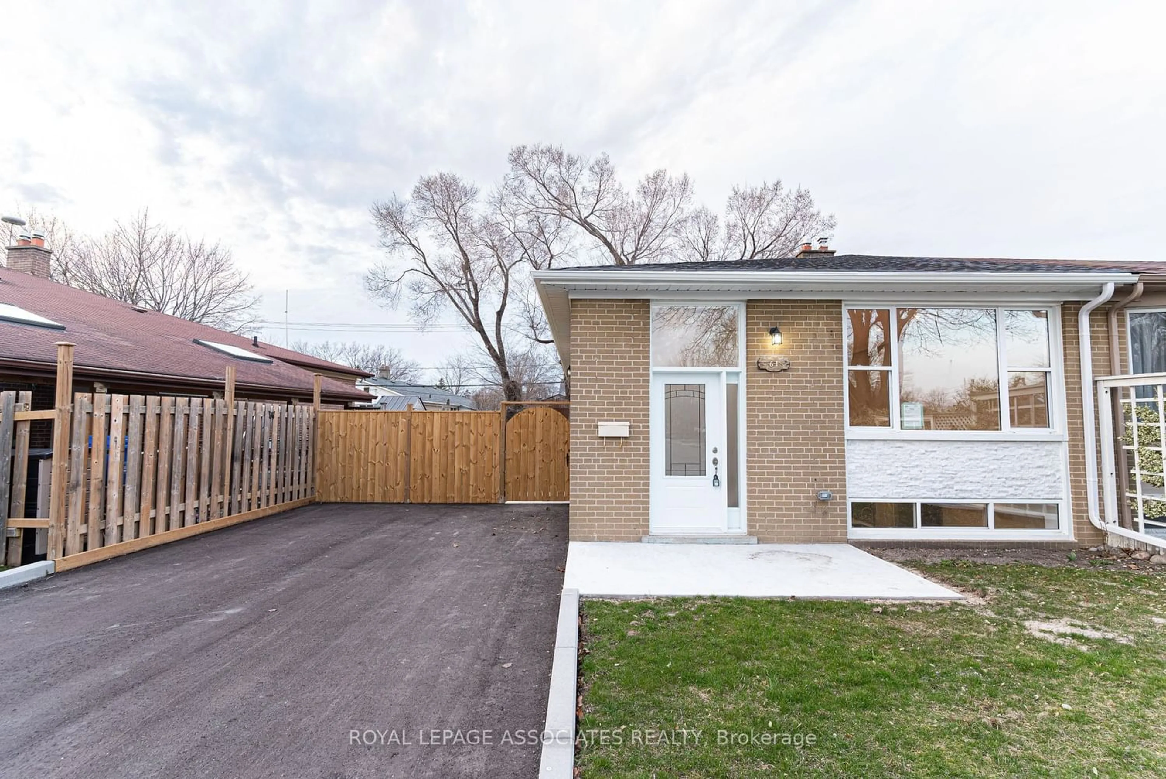 Frontside or backside of a home for 61 Tulloch Dr, Ajax Ontario L1S 2S3