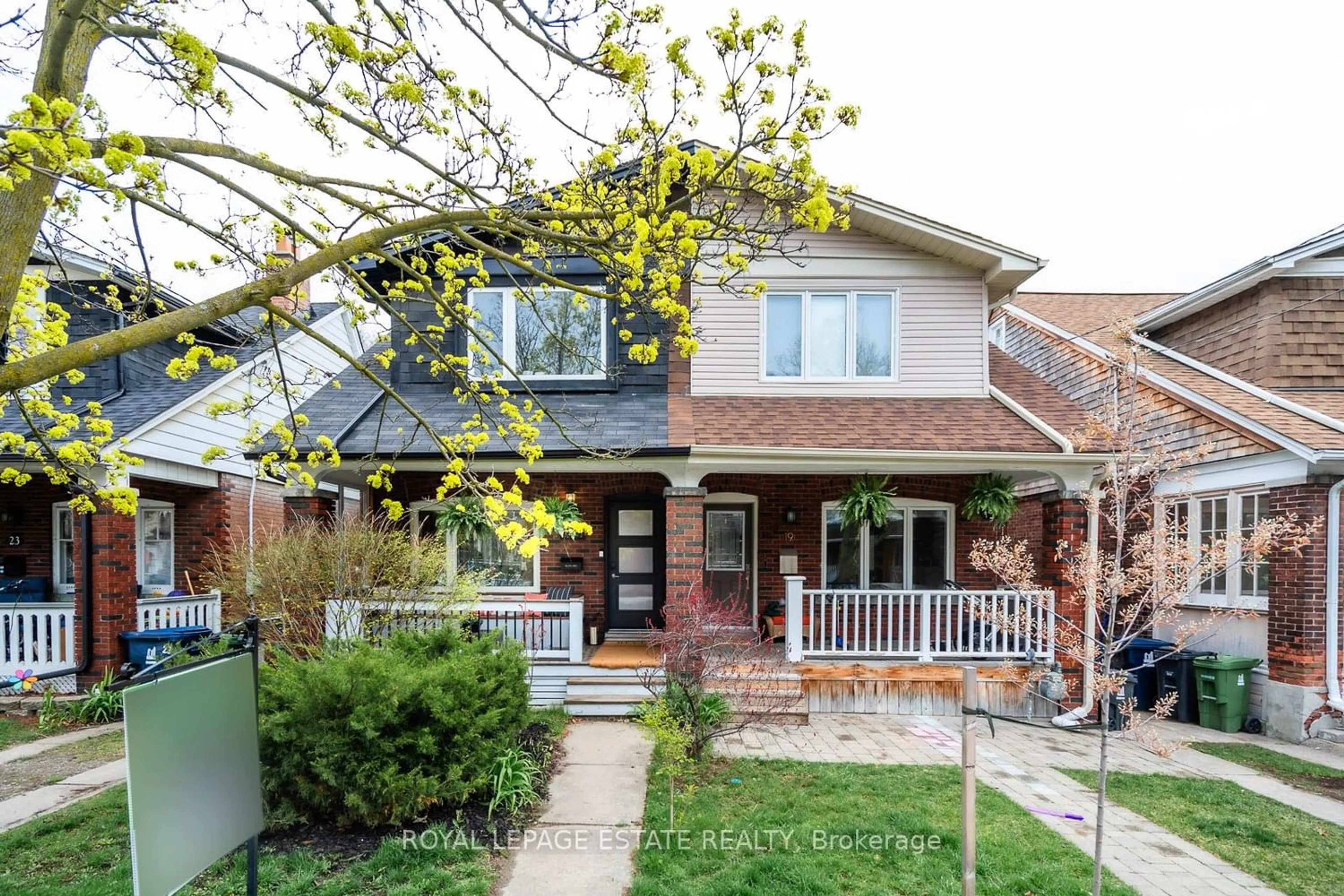 Home with brick exterior material for 21 Haslett Ave, Toronto Ontario M4L 3R1