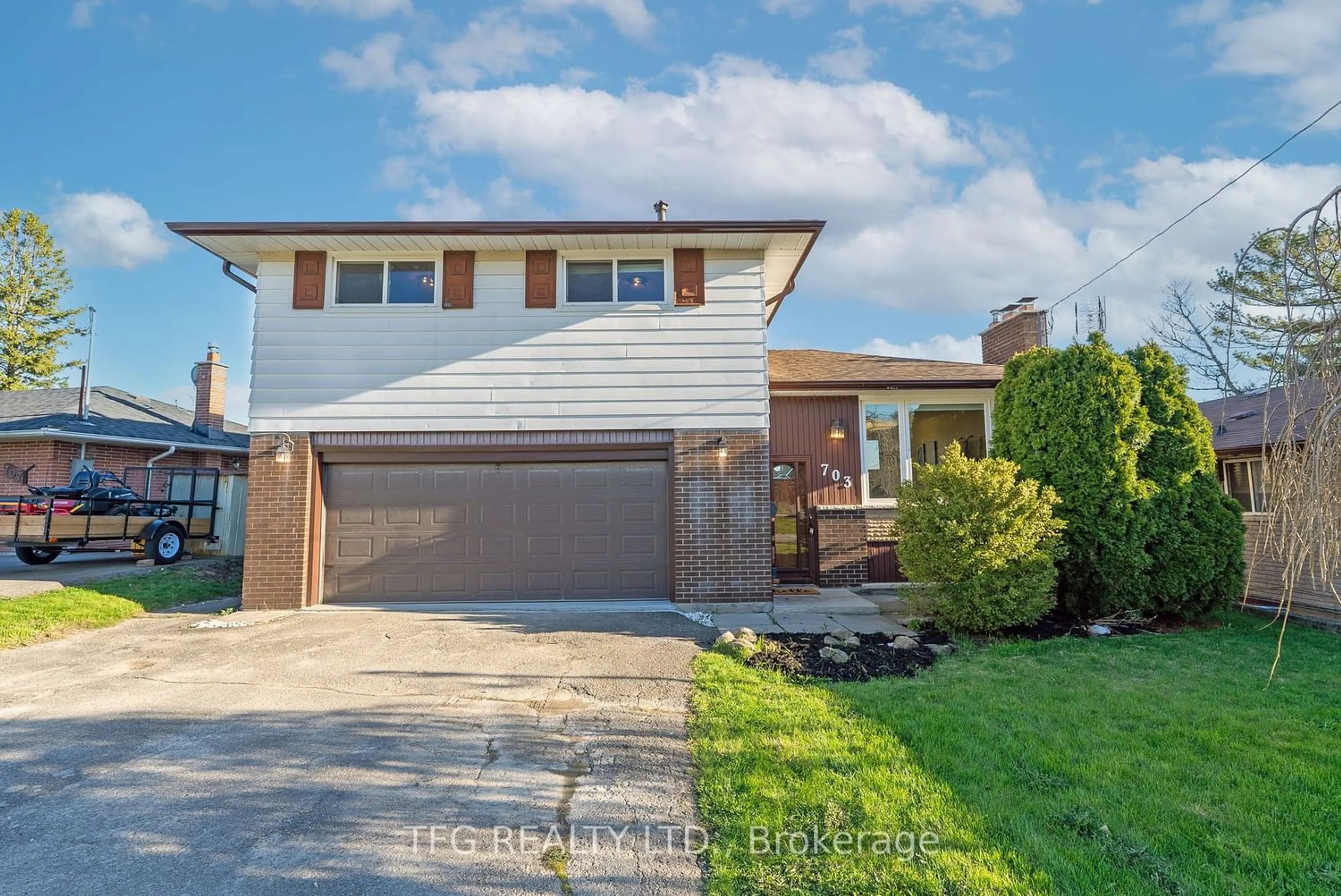 Frontside or backside of a home for 703 Tennyson Ave, Oshawa Ontario L1H 3K5