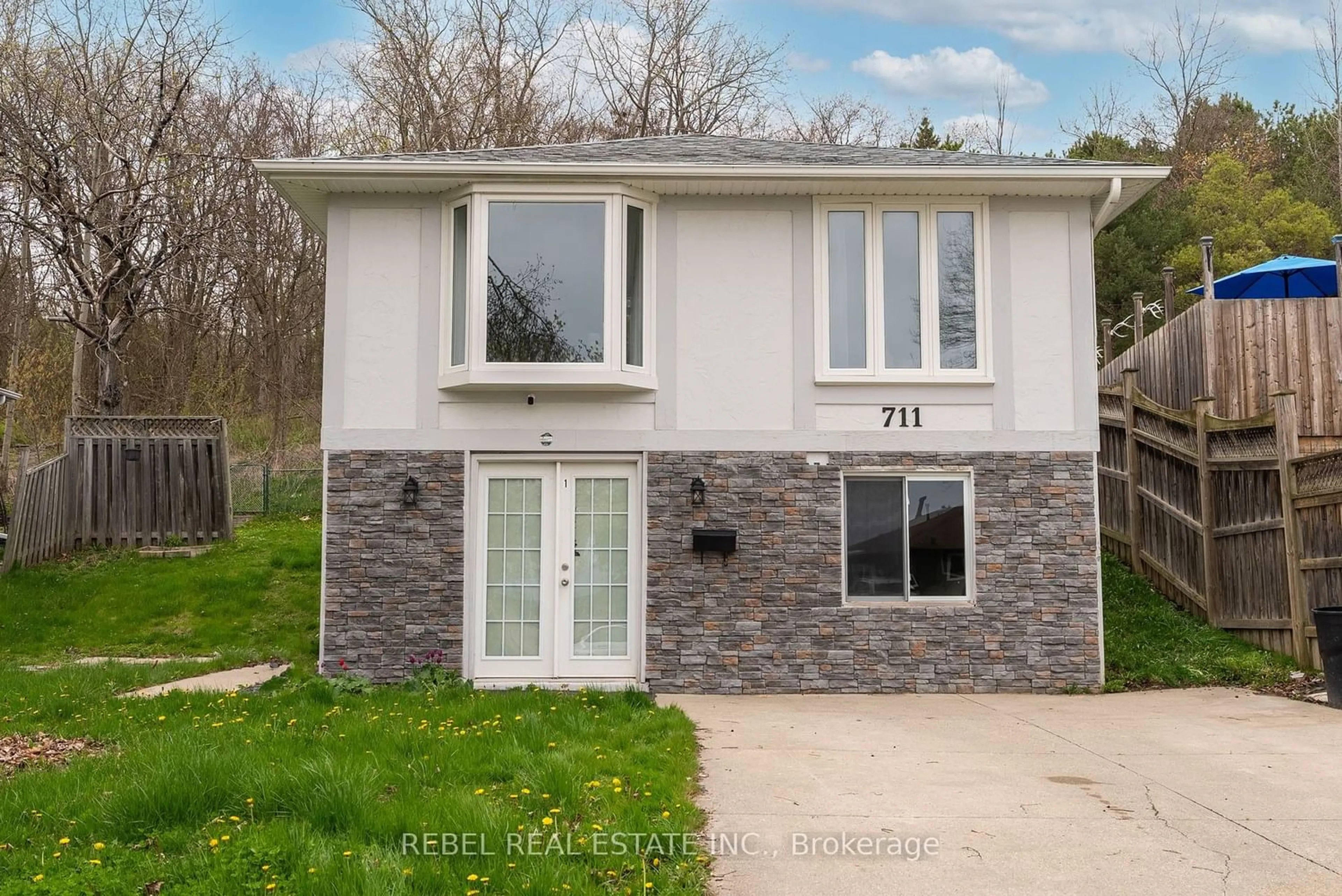 Frontside or backside of a home for 711 Wesley Dr, Oshawa Ontario L1H 7X6