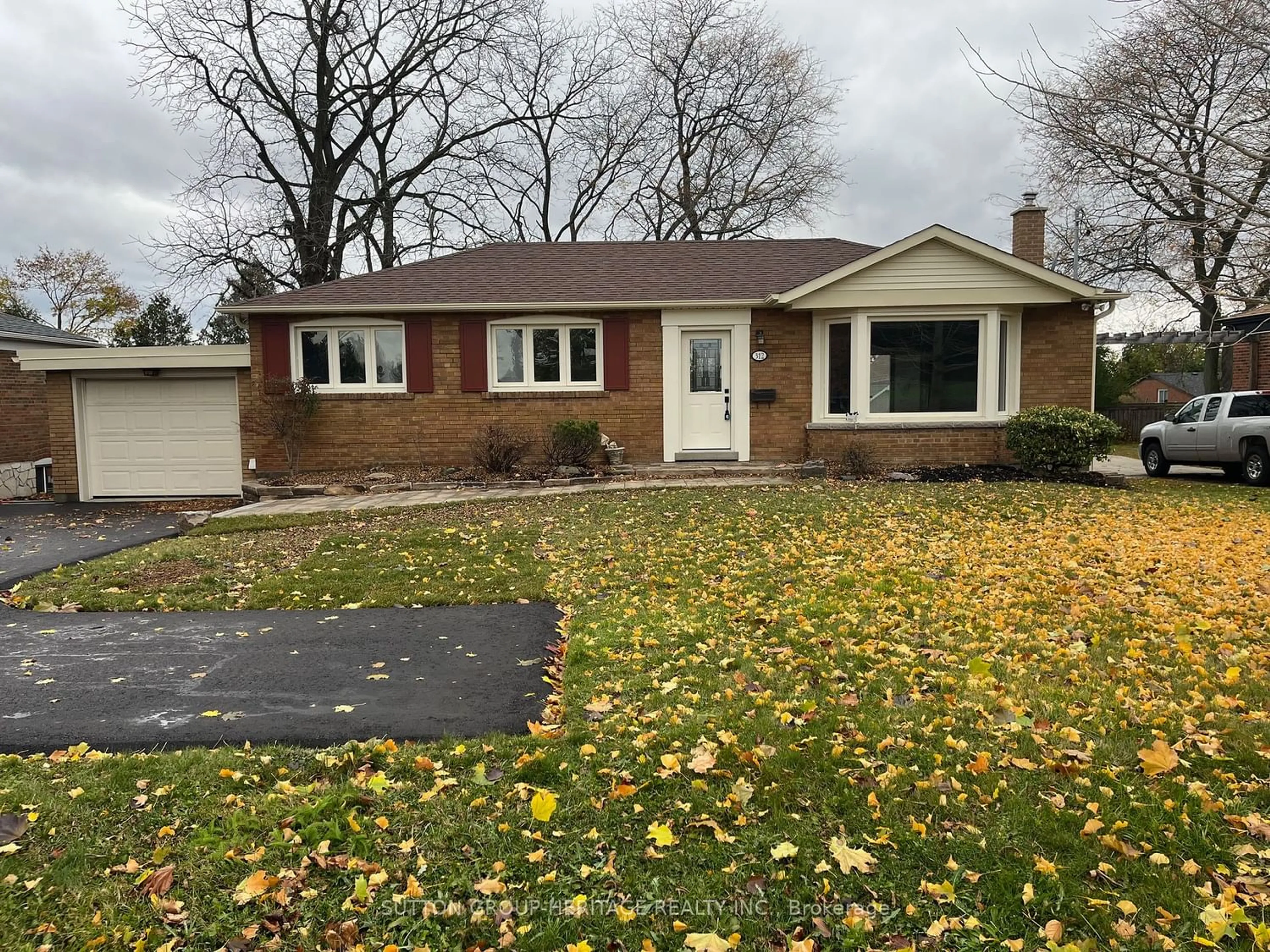 Home with brick exterior material for 312 Cochrane St, Whitby Ontario L1N 5J3