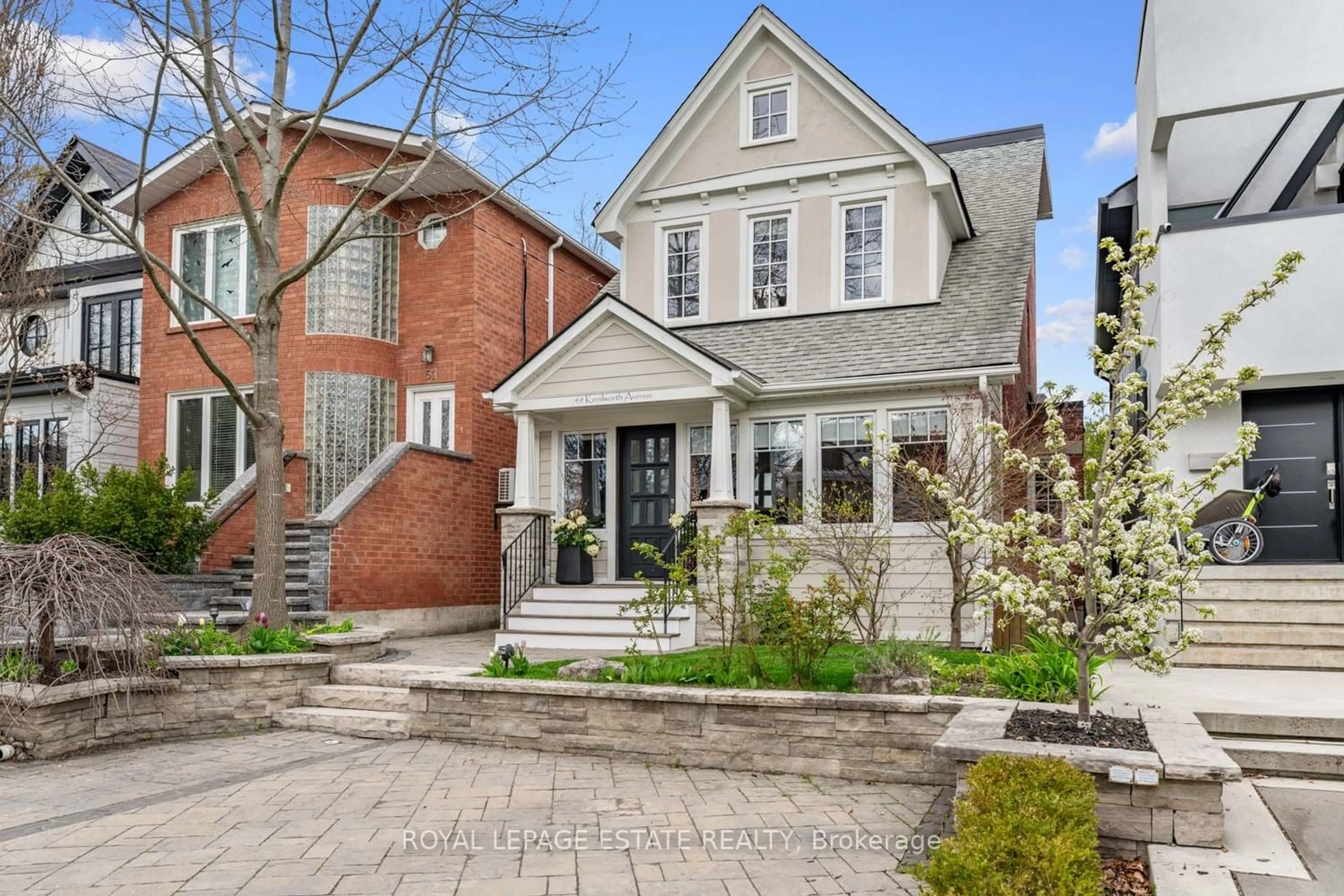 Home with brick exterior material for 49 Kenilworth Ave, Toronto Ontario M4L 3S4