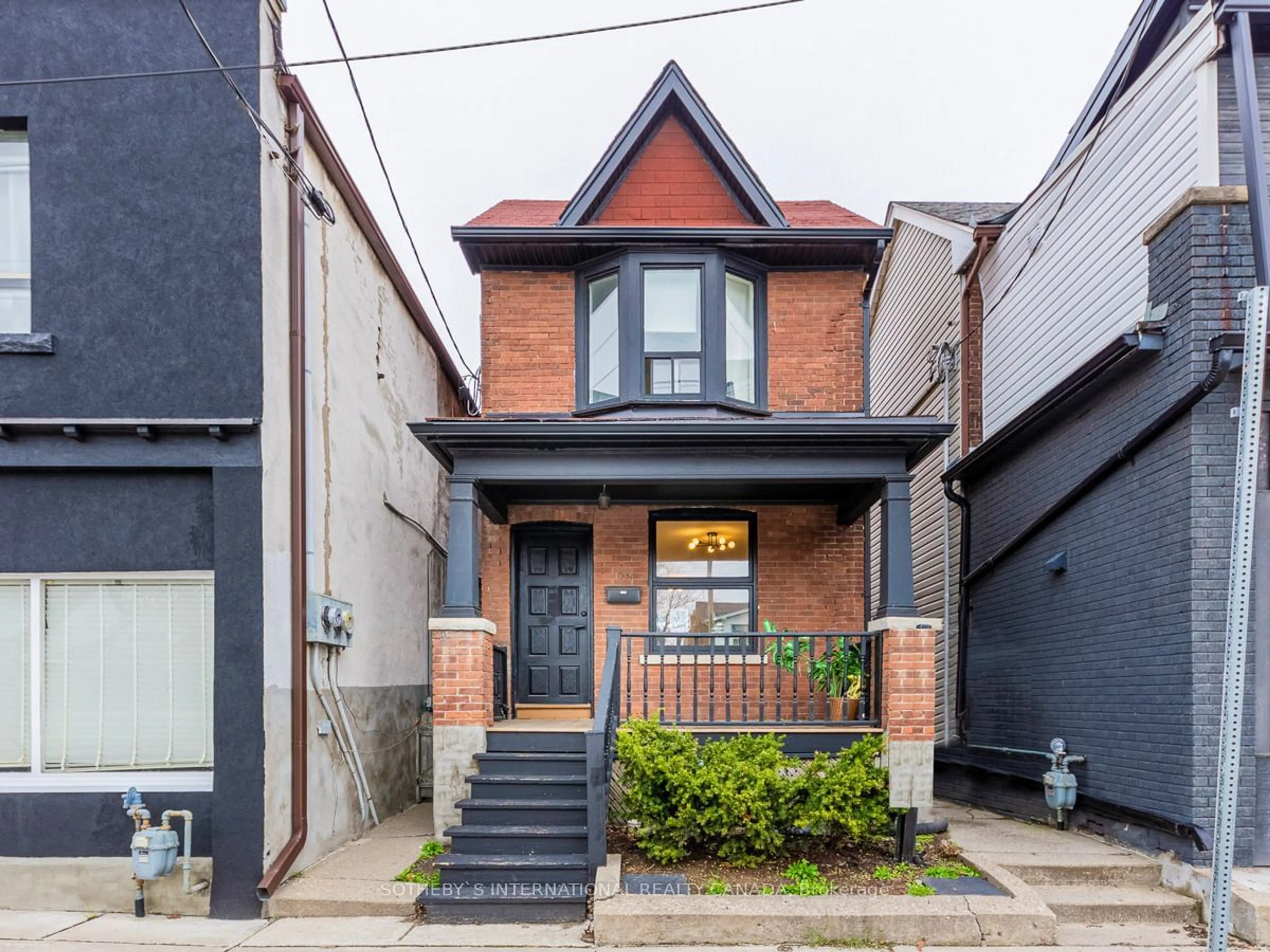 Home with brick exterior material for 1055 Woodbine Ave, Toronto Ontario M4C 4C2