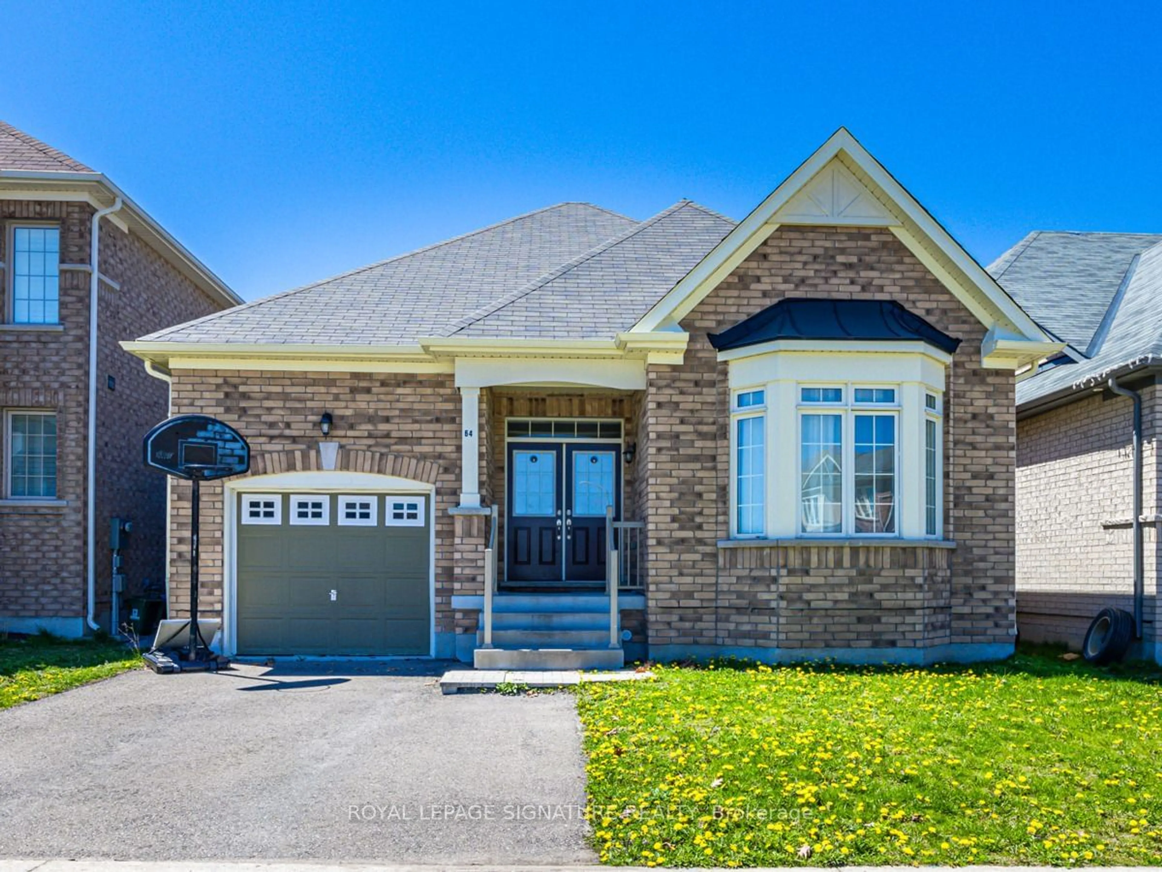 Home with brick exterior material for 64 Pedwell St, Clarington Ontario L1B 0E1