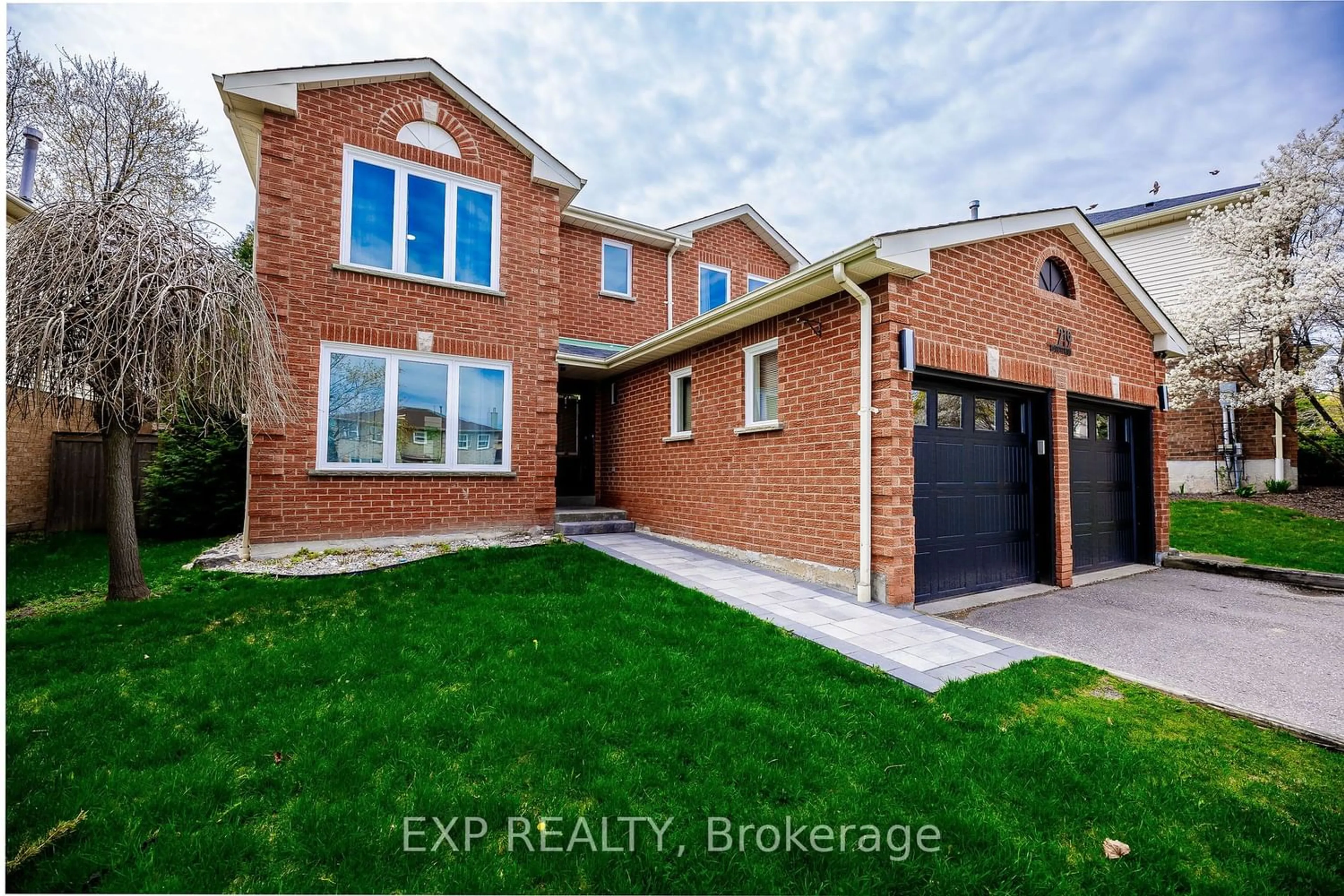 Home with brick exterior material for 219 Bassett Blvd, Whitby Ontario L1R 1S4