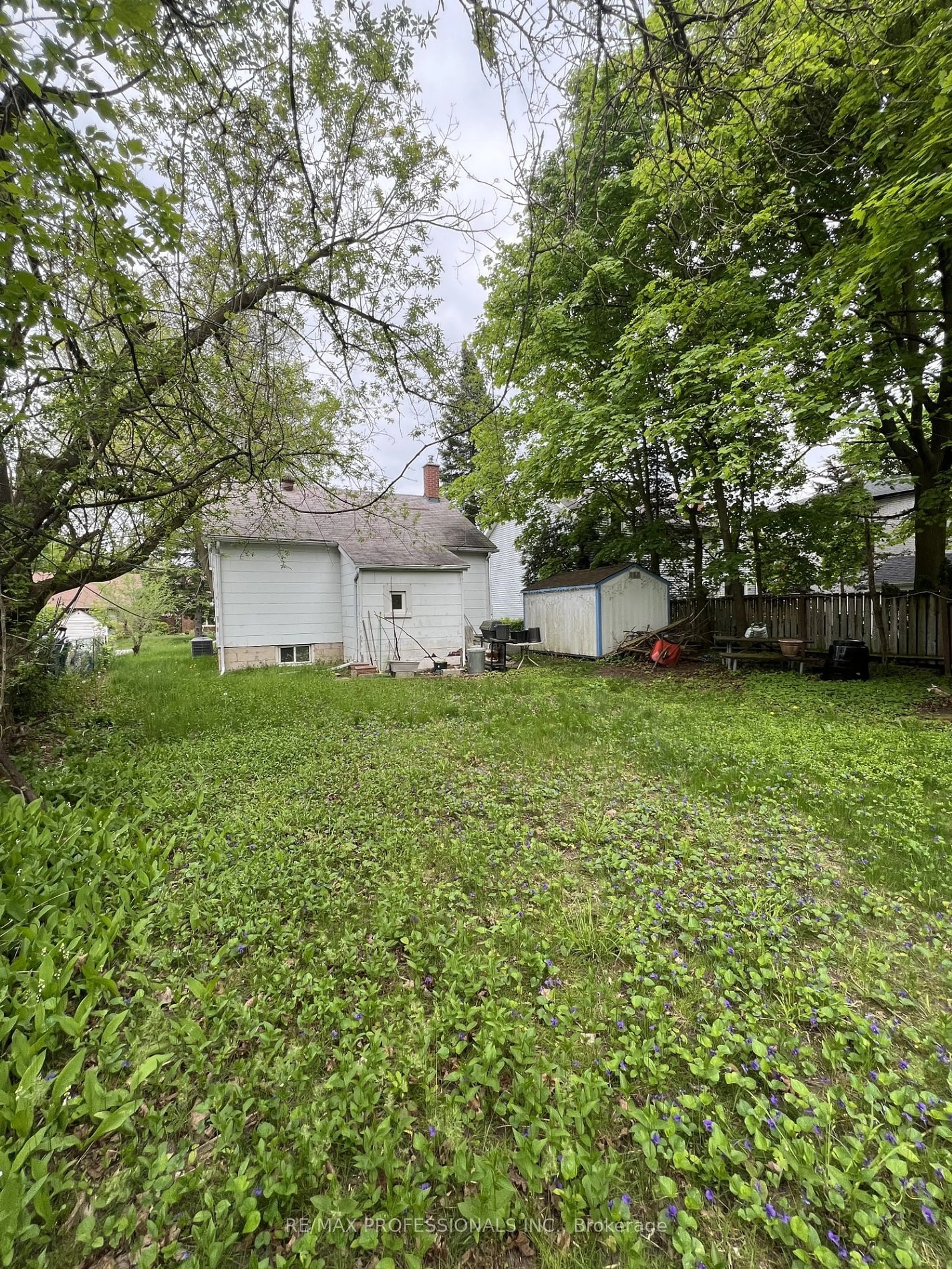 Frontside or backside of a home, the fenced backyard for 42 Fairwood Cres, Toronto Ontario M1E 3T3