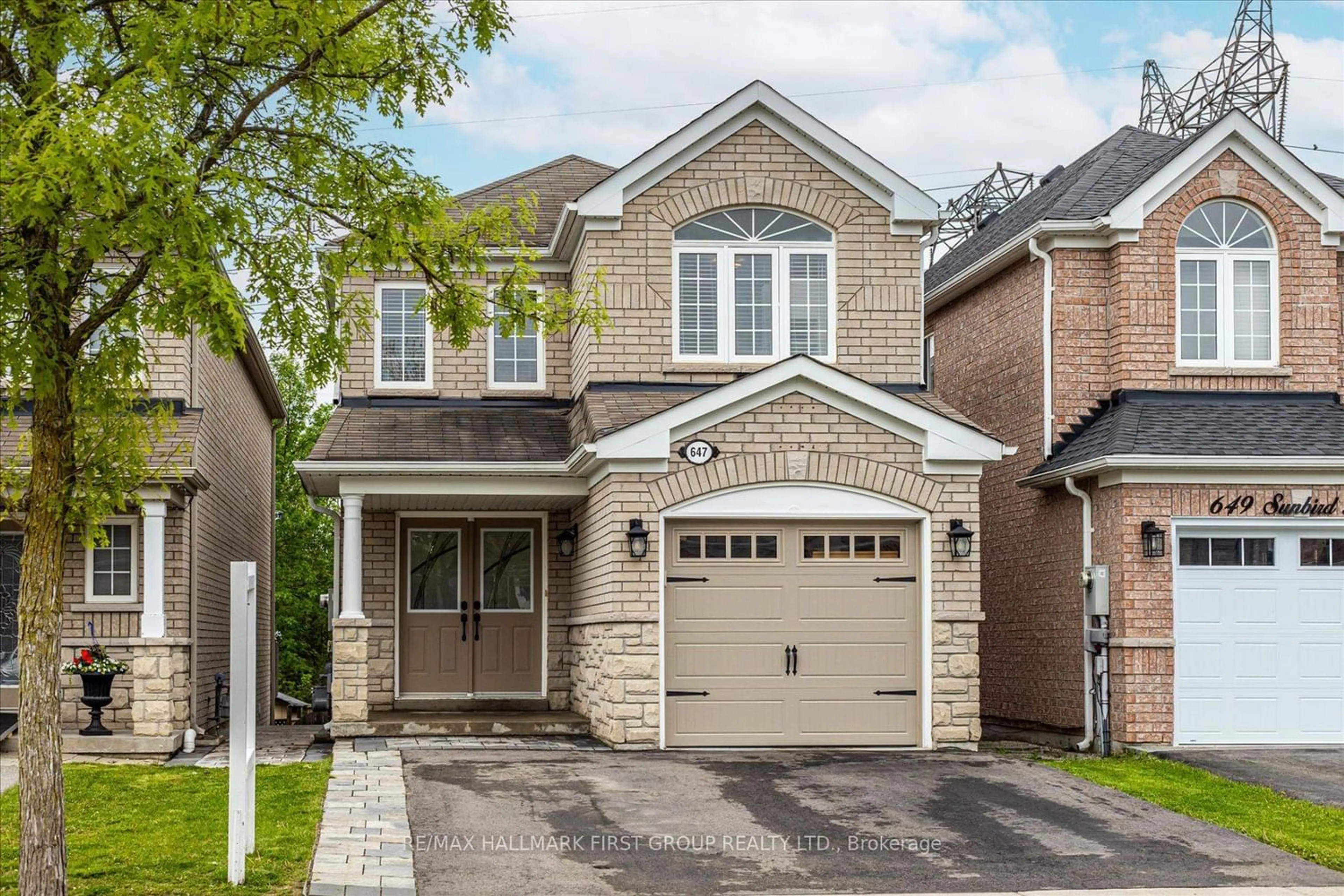 Home with brick exterior material for 647 Sunbird Tr, Pickering Ontario L1X 2X7