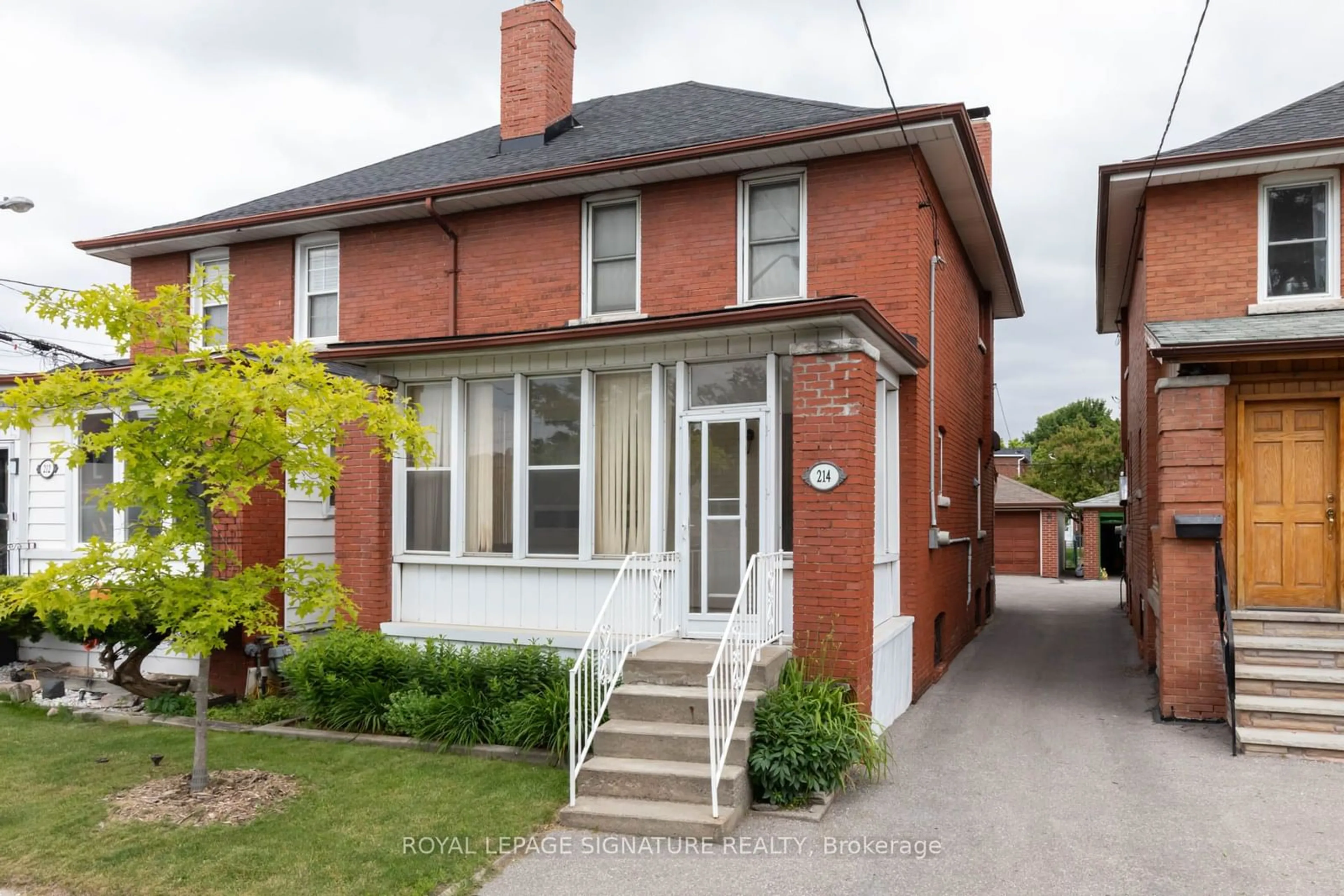 Home with brick exterior material for 214 Mortimer Ave, Toronto Ontario M4J 2C5