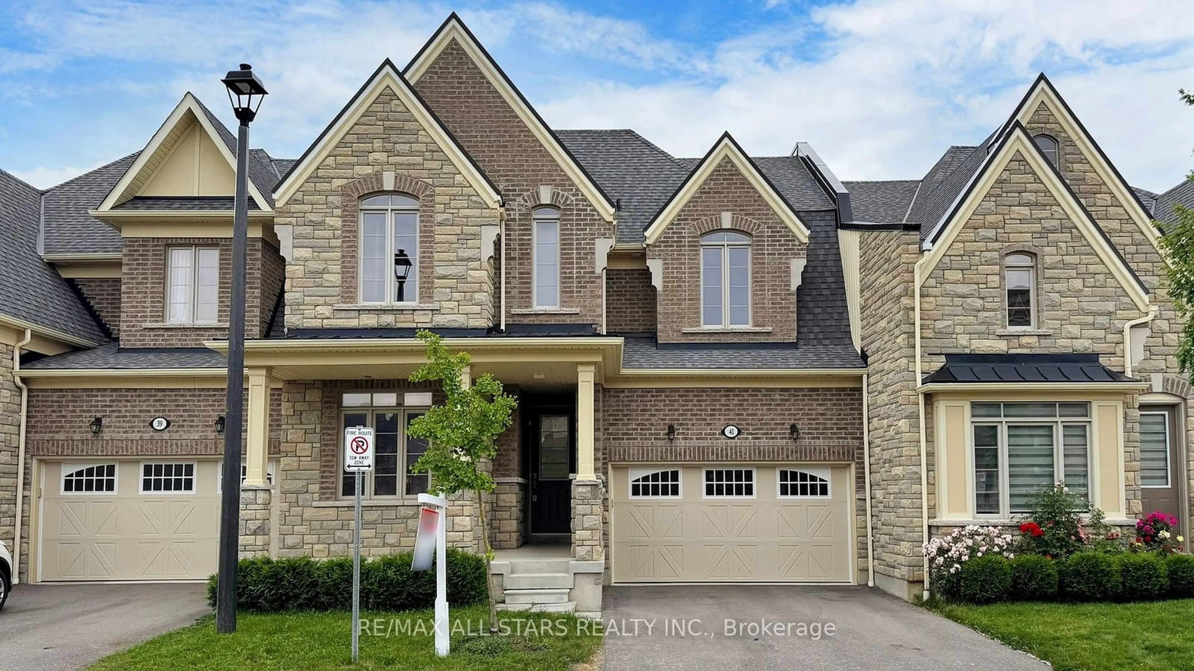 Home with brick exterior material for 41 WORKMEN'S Circ, Ajax Ontario L1T 0N7