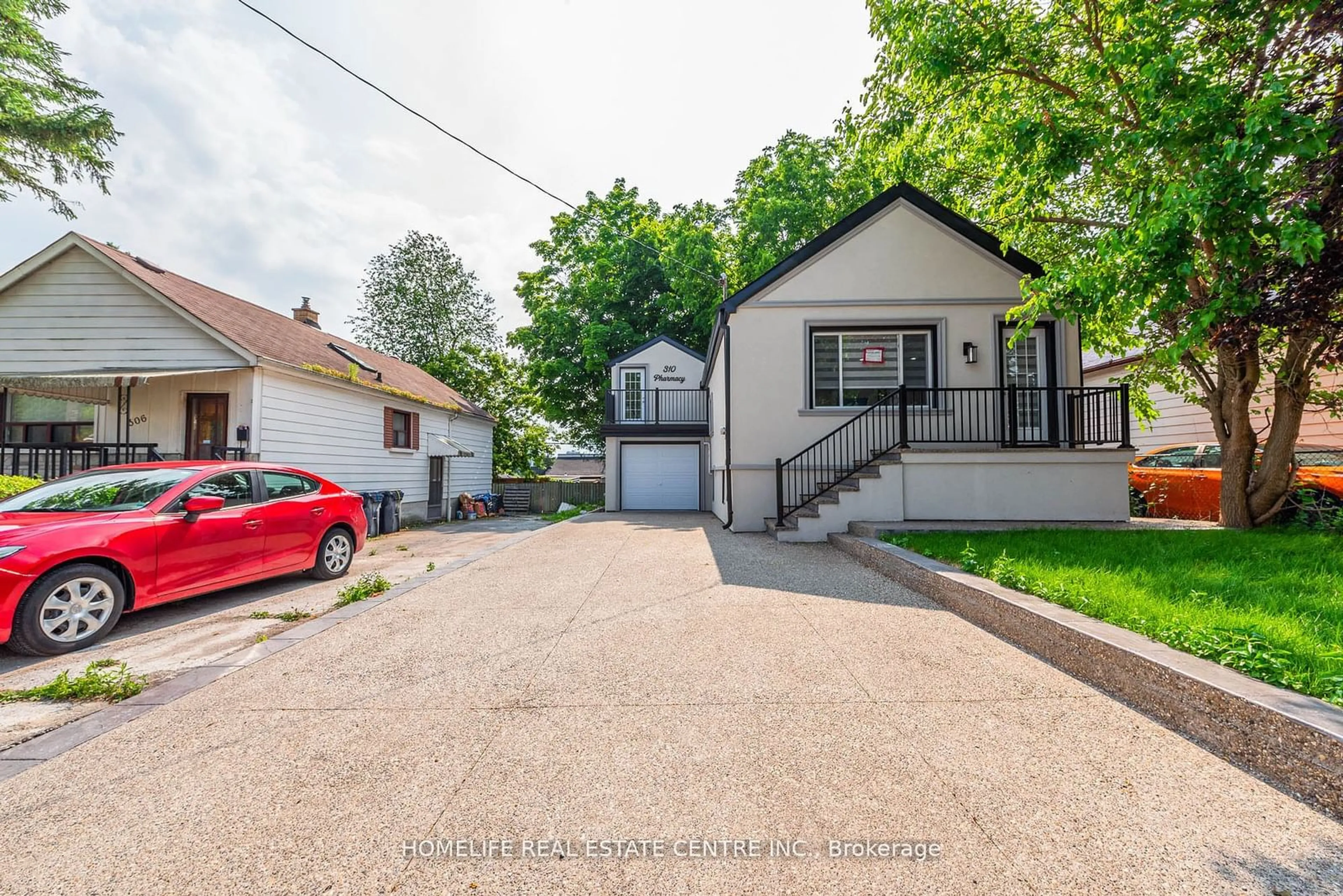 Frontside or backside of a home for 310 Pharmacy Ave, Toronto Ontario M1L 3G3