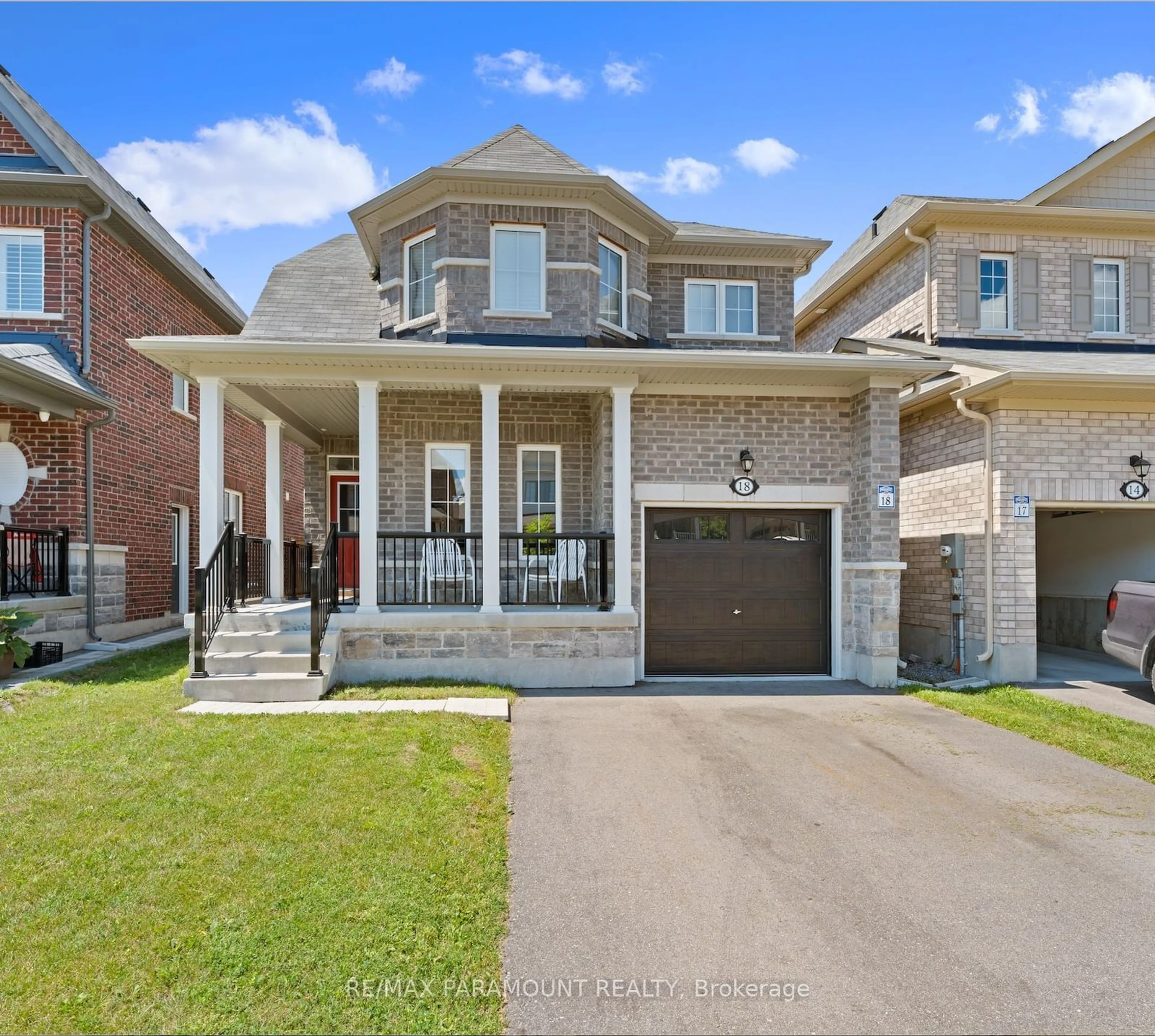 Frontside or backside of a home for 18 Tait Cres, Clarington Ontario L1C 0R8