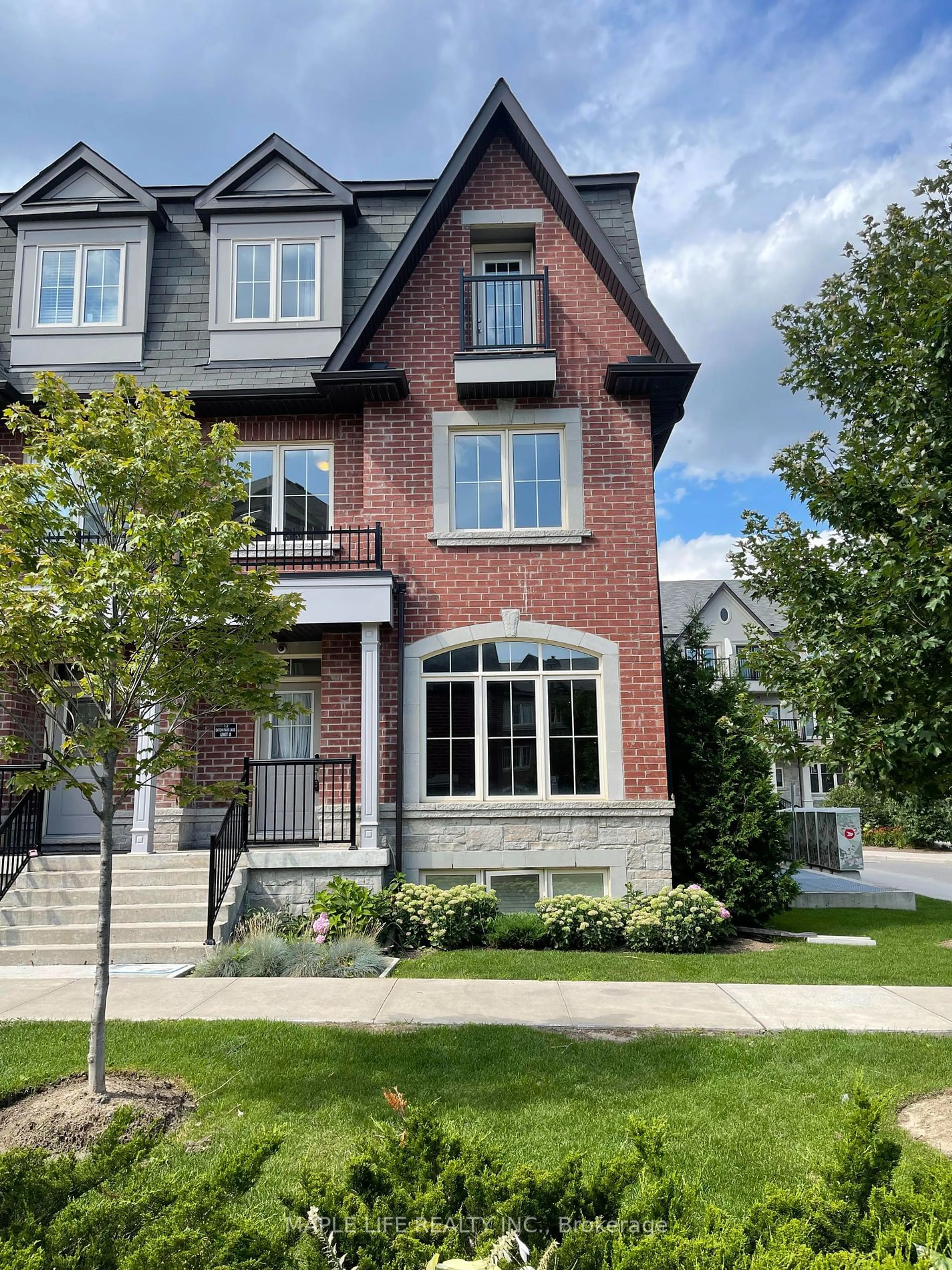 Home with brick exterior material for 12 Eaton Park Lane #8, Toronto Ontario M1W 0A5