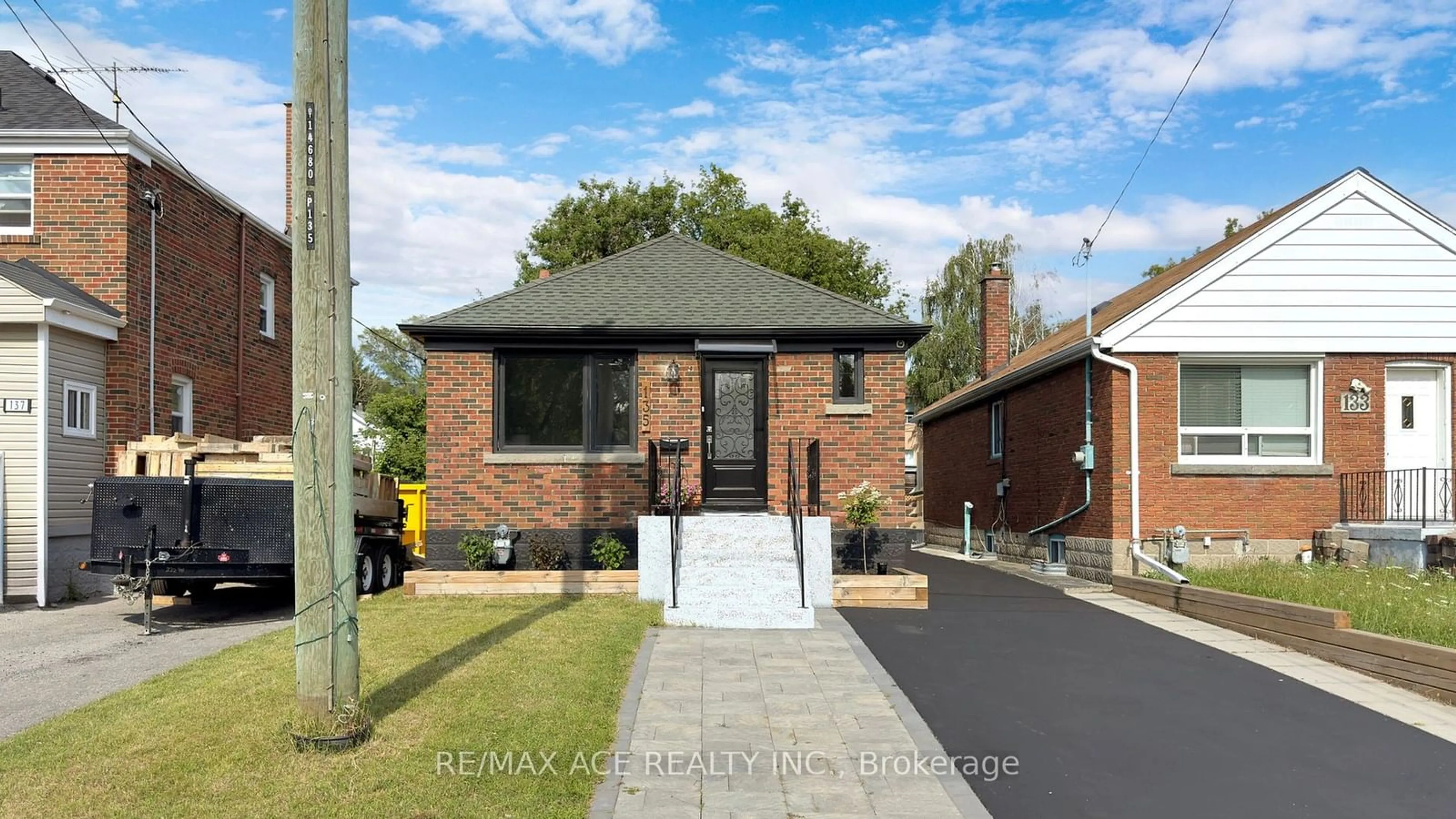 Home with brick exterior material for 135 August Ave, Toronto Ontario M1L 3M9